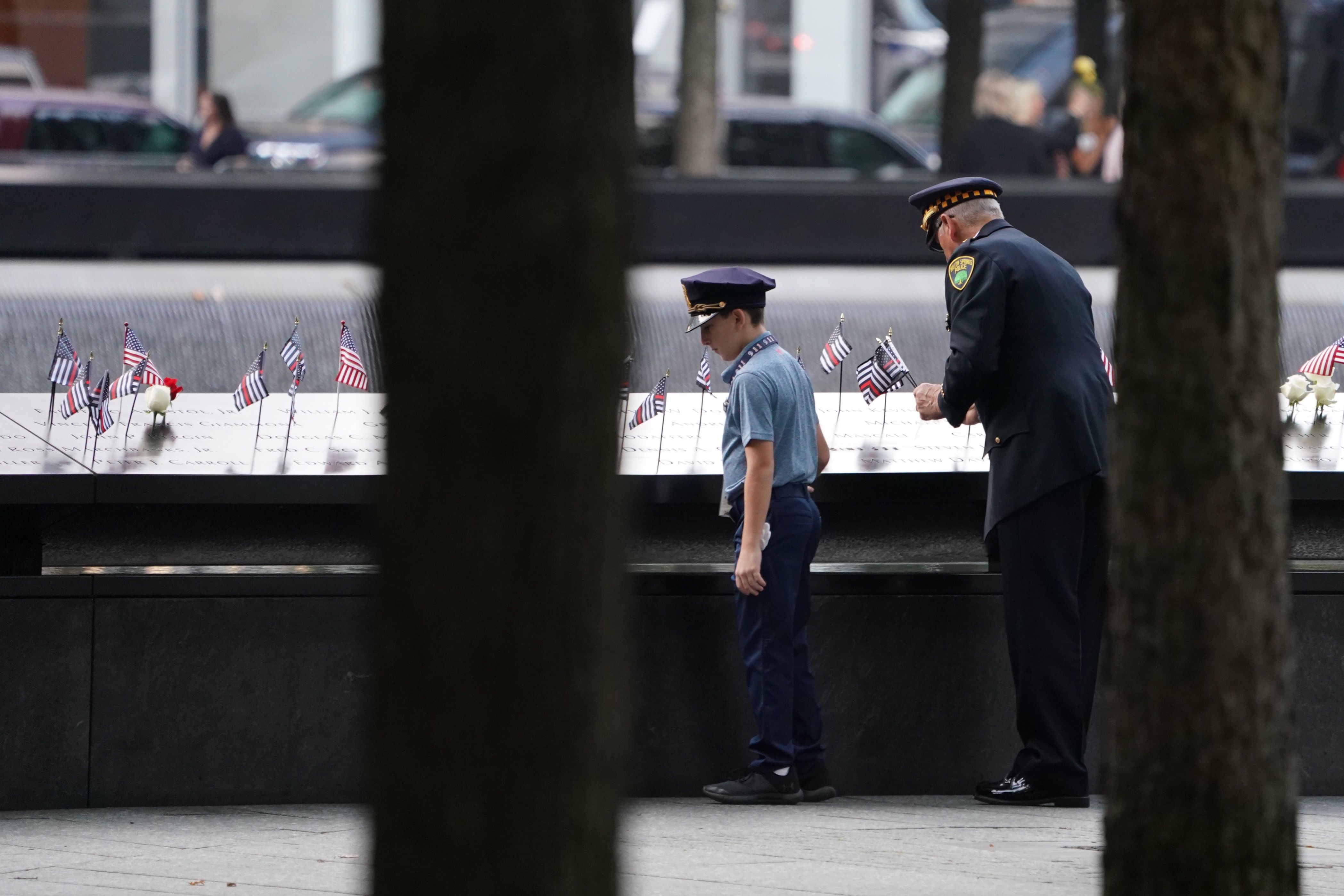 Observers attend the September 11 Commemoration Ceremony at the 9/11 Memorial at the World Trade Center on Wednesday.