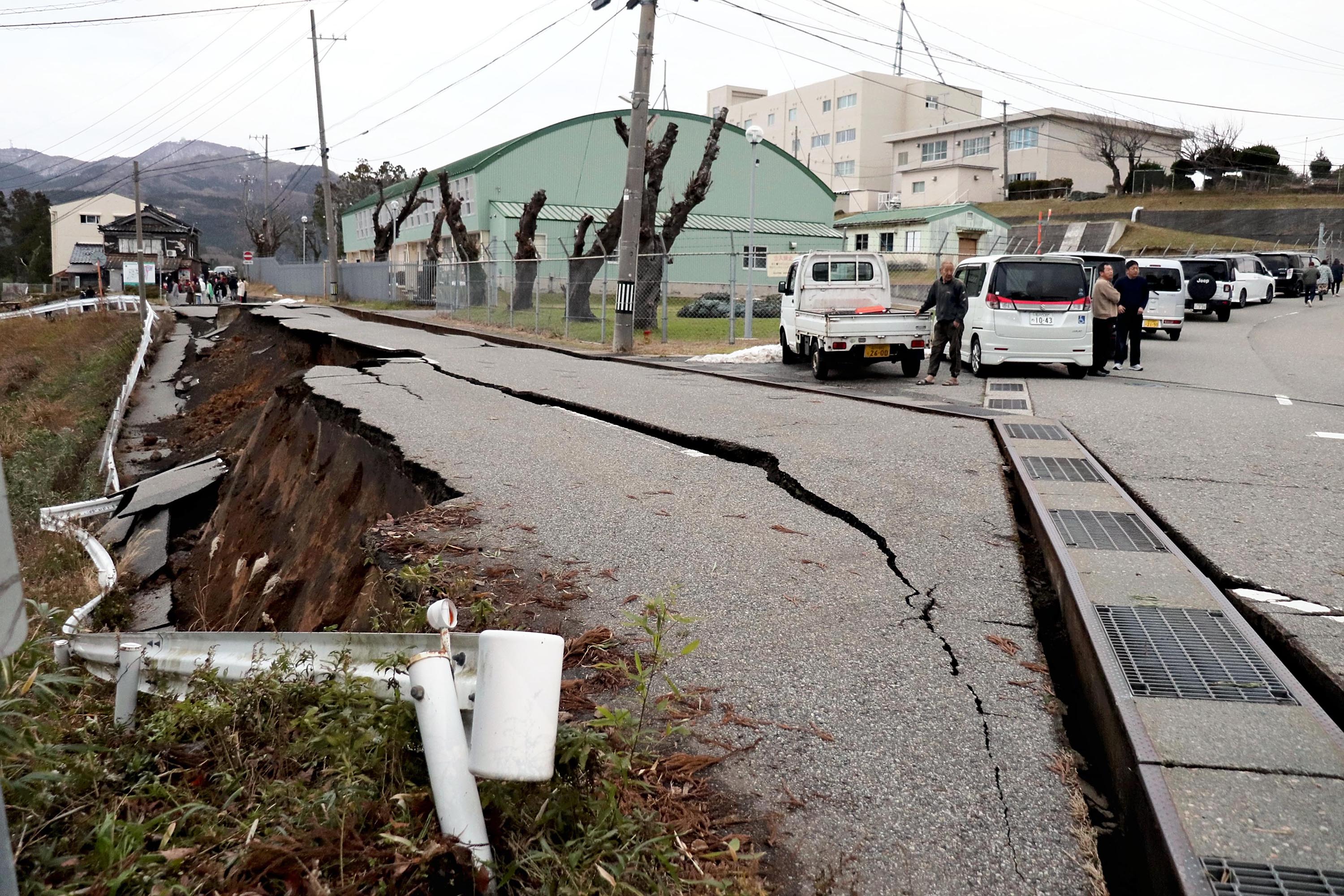 Residents survey damage following an earthquake in Wajima City, Japan, on January 1. 