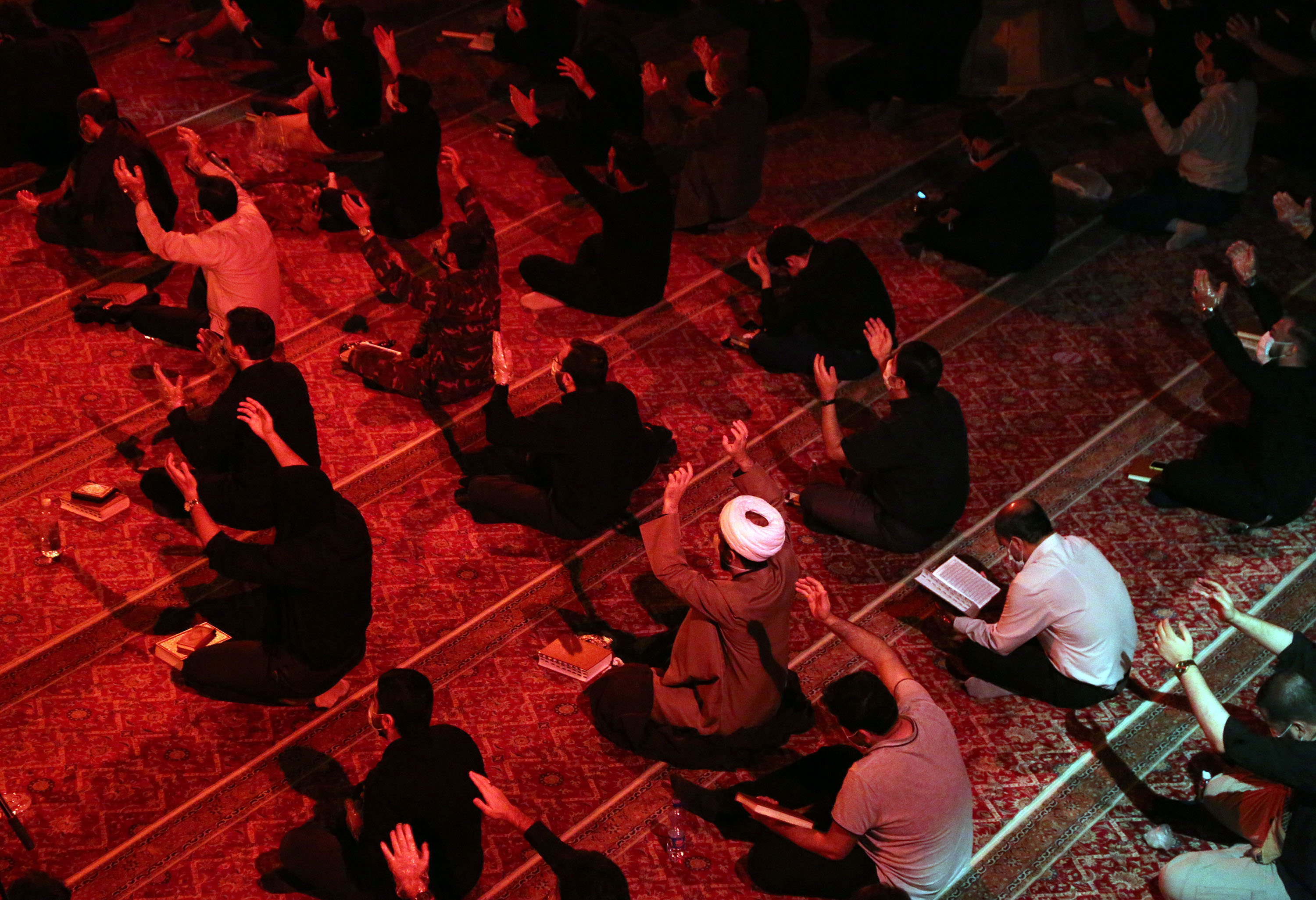 Iranians observe Laylat al-Qadr (the Night of Power) during Ramadan, while social distancing amid the coronavirus pandemic at the Imam Jafar Sadegh Mosque in Tehran, Iran, on Sunday, May 17.