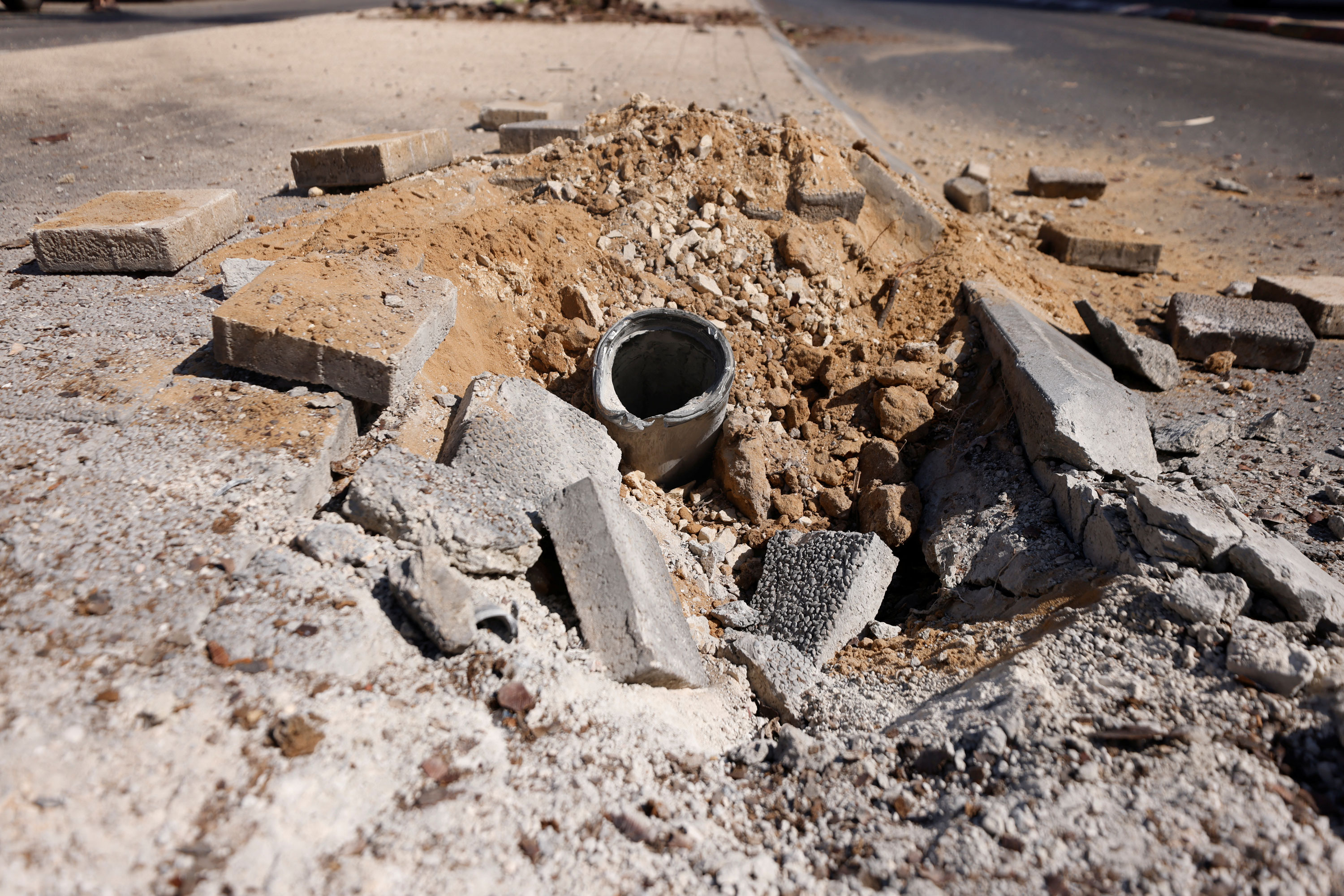 A remnant of a rocket launched from Gaza lies on the ground, in Ashkelon, Israel, on October 7, 2023.