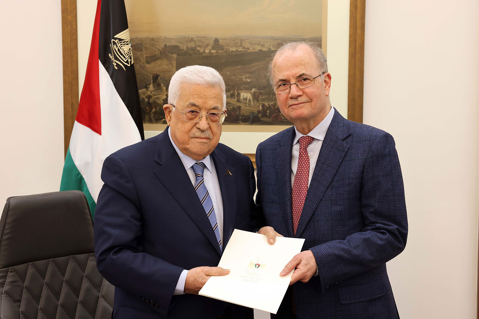 Palestinian President Mahmoud Abbas, left, poses with Mohammed Mustafa after appointeing him as the new Prime Minister in Ramallah, on Thursday, March 14. (