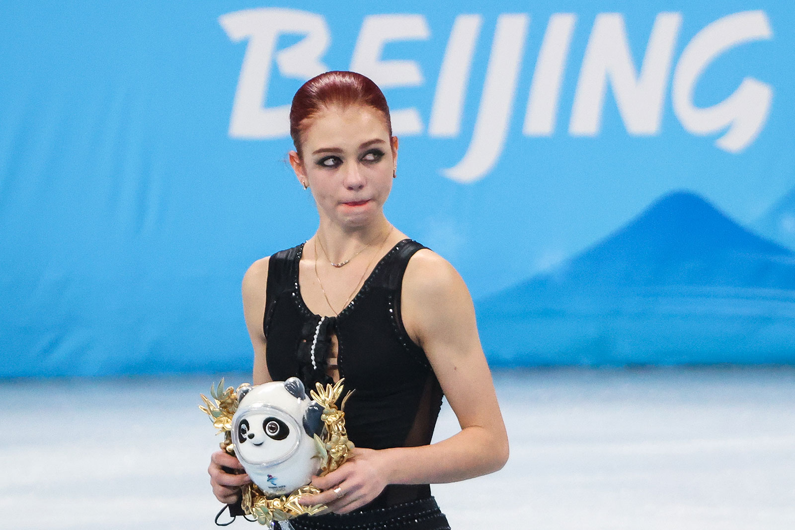 Russian figure skater Alexandra Trusova looks on during the flower ceremony following the women's free skate program. 