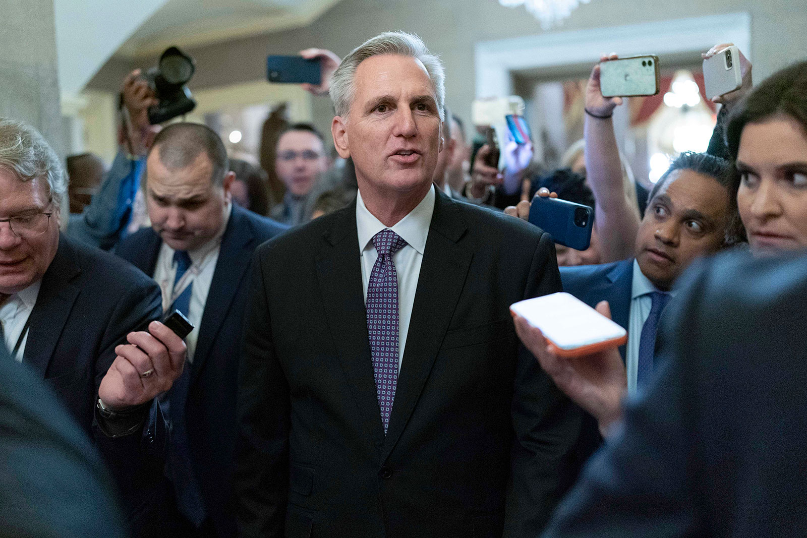 Rep. Kevin McCarthy talks to reporters as he walks to his office after the House adjourned until later this evening. 