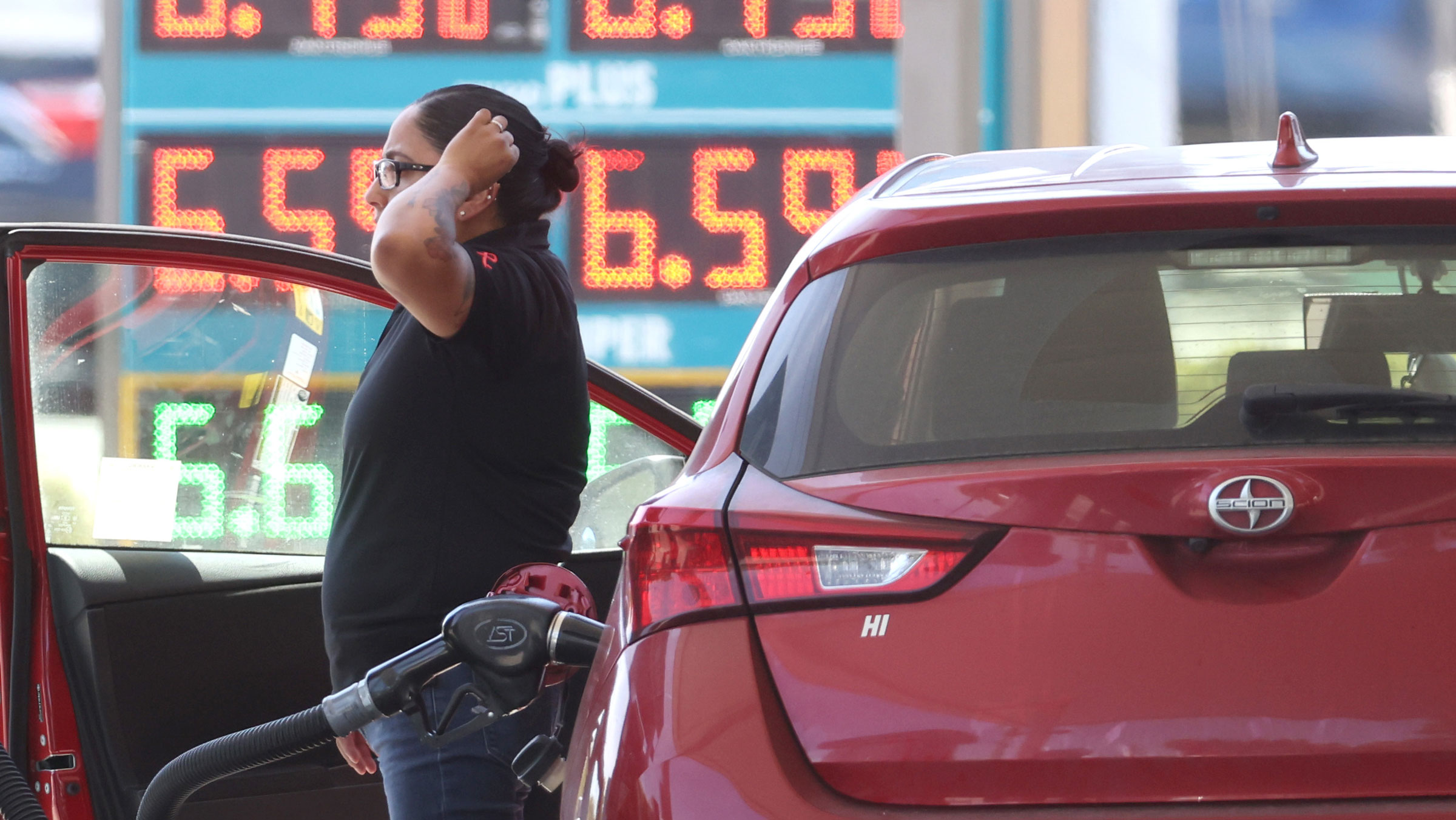 A customer pumps gas into their car in Petaluma, California, last month.