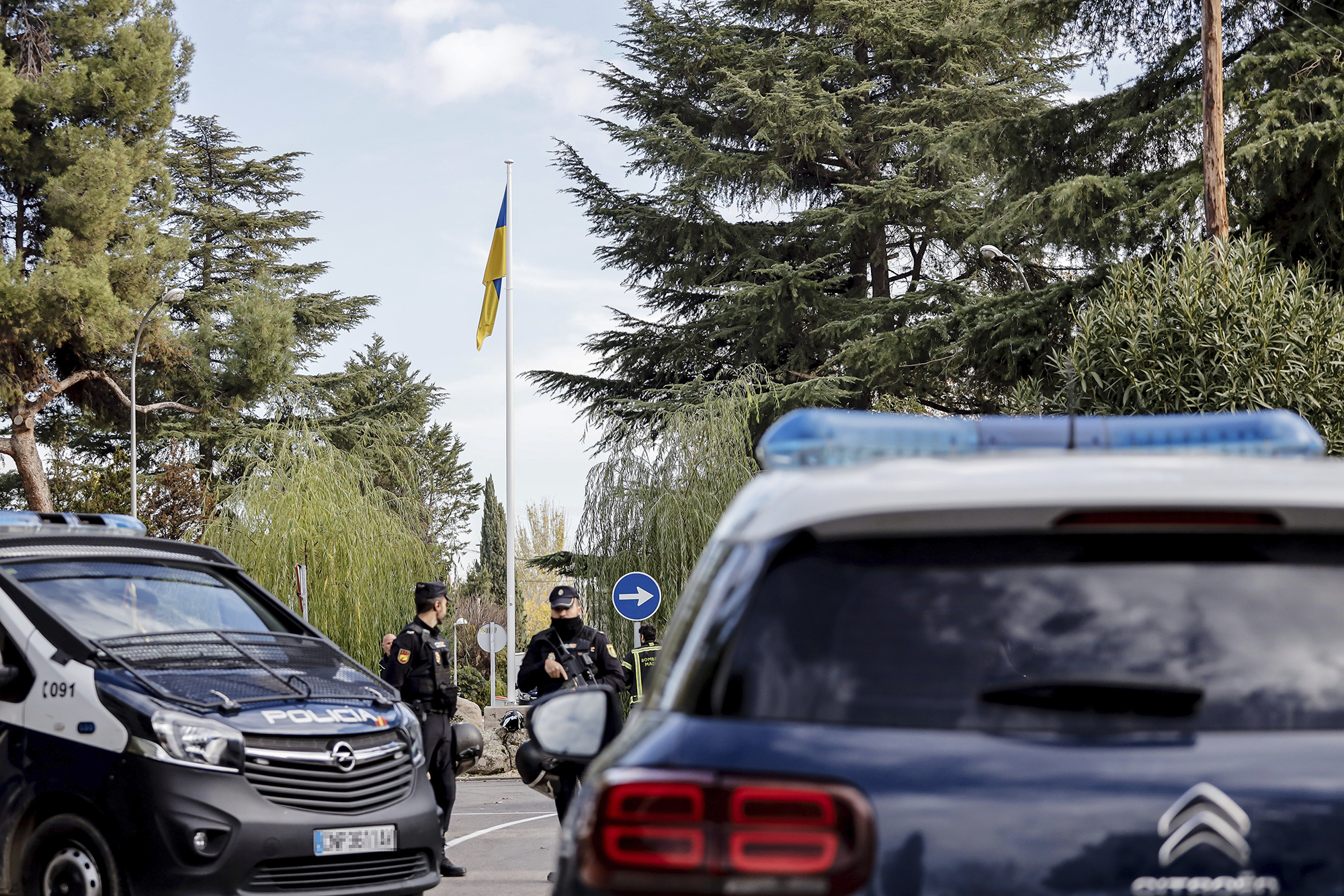 Two police officers at the Ukrainian embassy where an explosion occurred, on November 30, in Madrid, Spain.