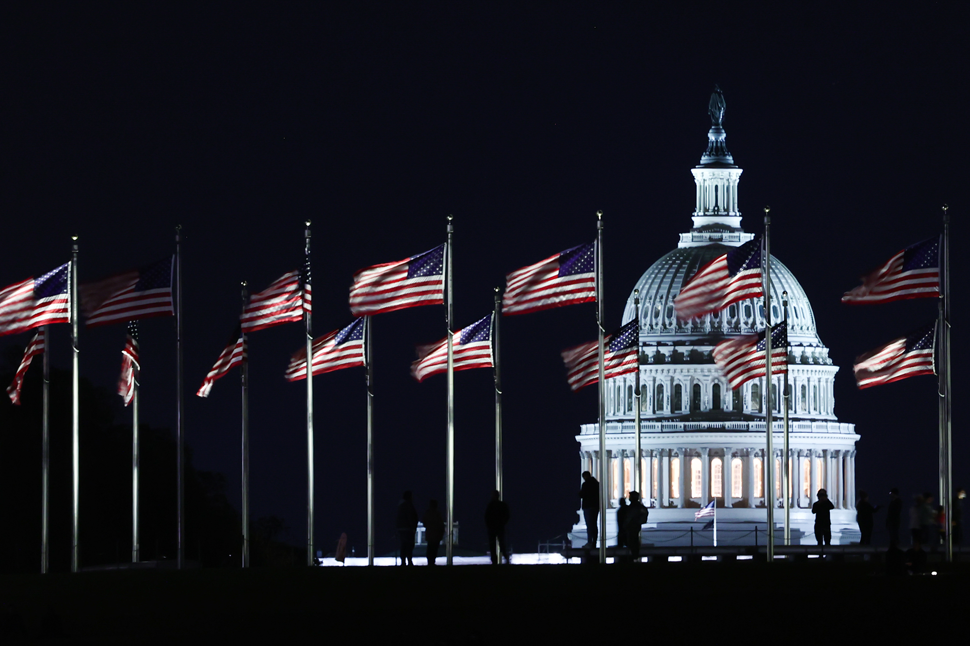 The Capitol building is seen through the American flags in Washington, D.C. on October 20.