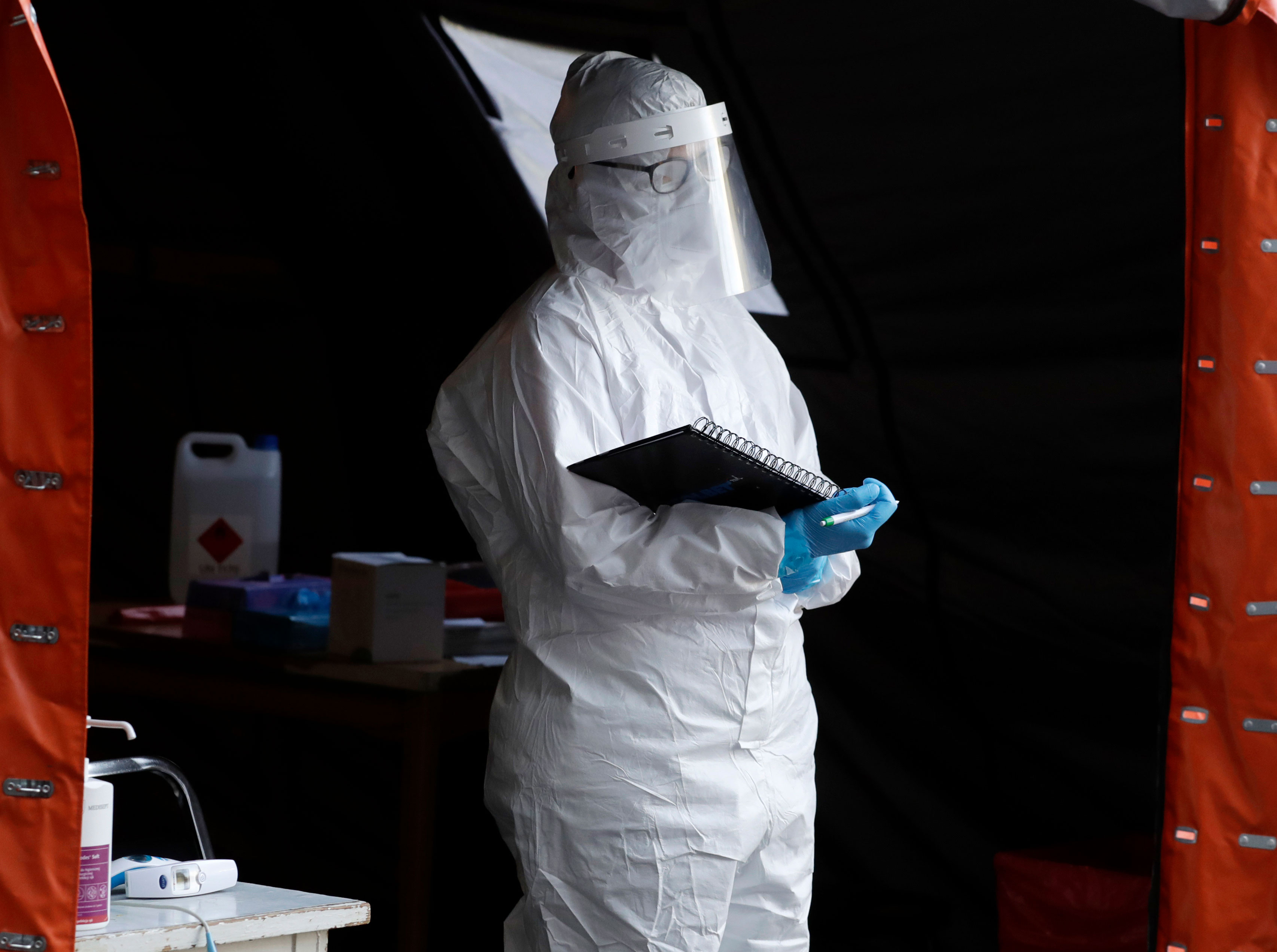 A medical worker in Warsaw, Poland, waits at a Covid-19 testing center on October 22.