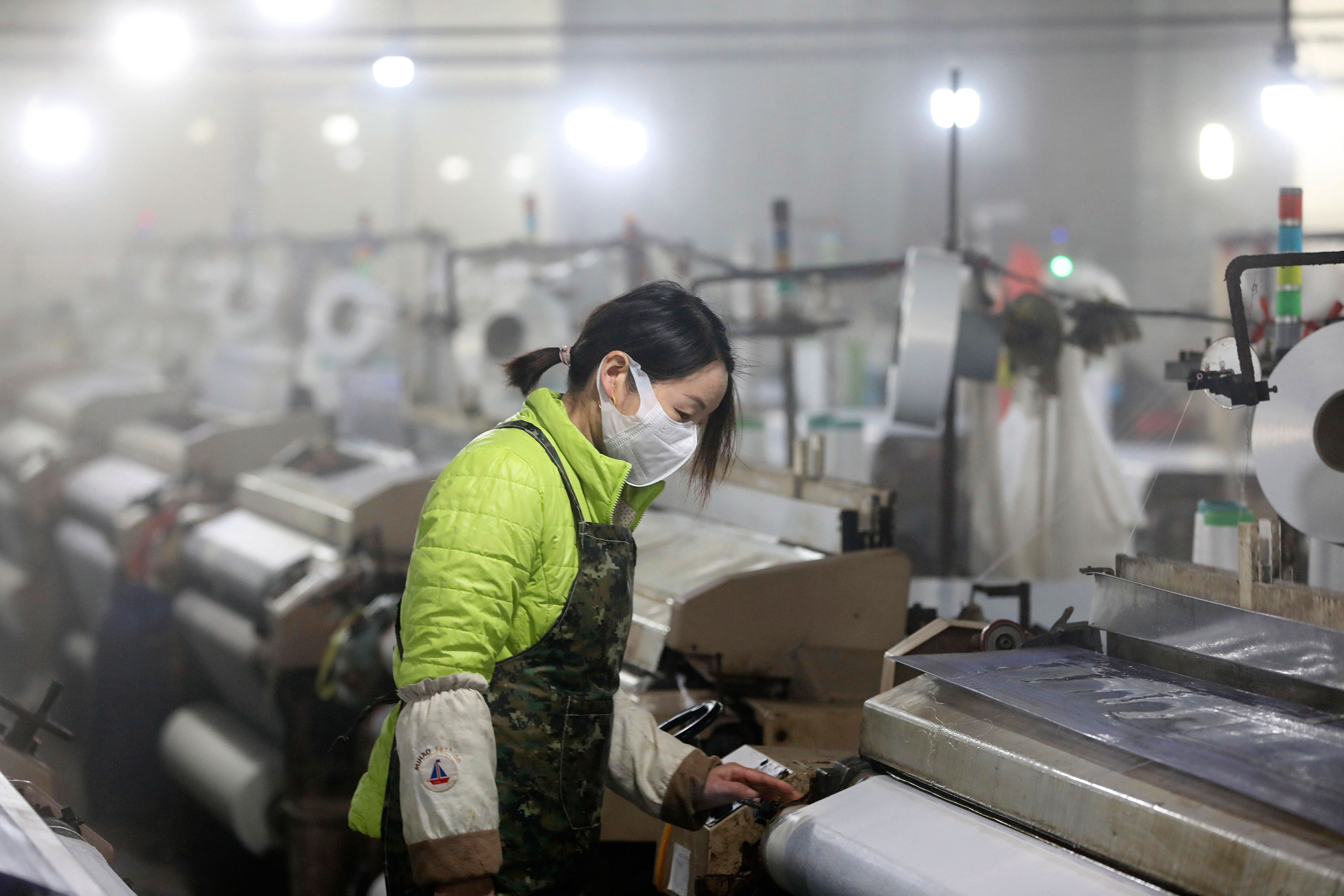 A woman works at a textile factory in Hangzhou, China on February 27.
