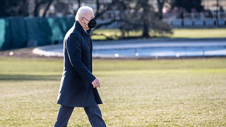 President Joe Biden walking towards the Oval Office after returning to the White House via Marine One on Monday, December 20. 