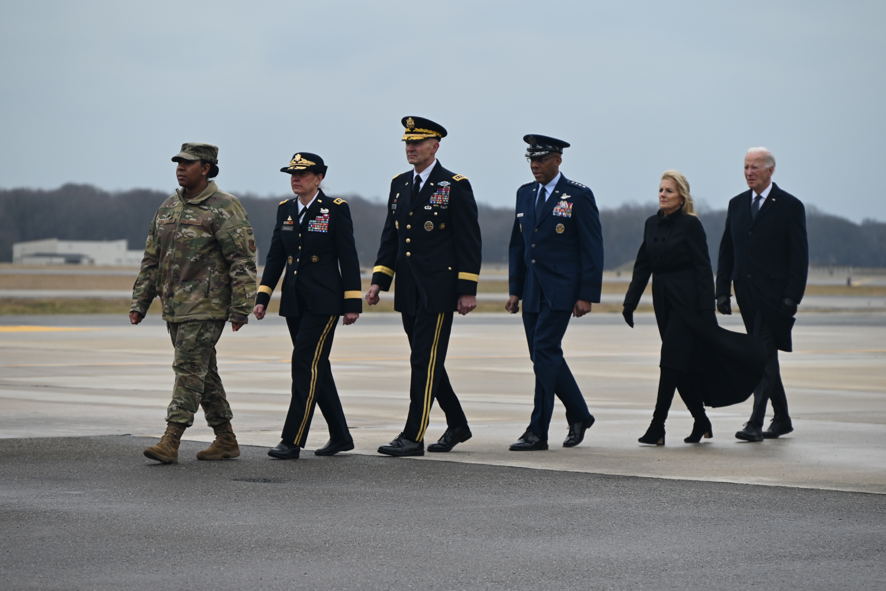 US President Joe Biden, right, and US First Lady Jill Biden, second from right, participate in a dignified transfer of the three soldiers killed in a drone attack in Jordan, at Dover Air Force Base in Dover, Delaware on February 2.