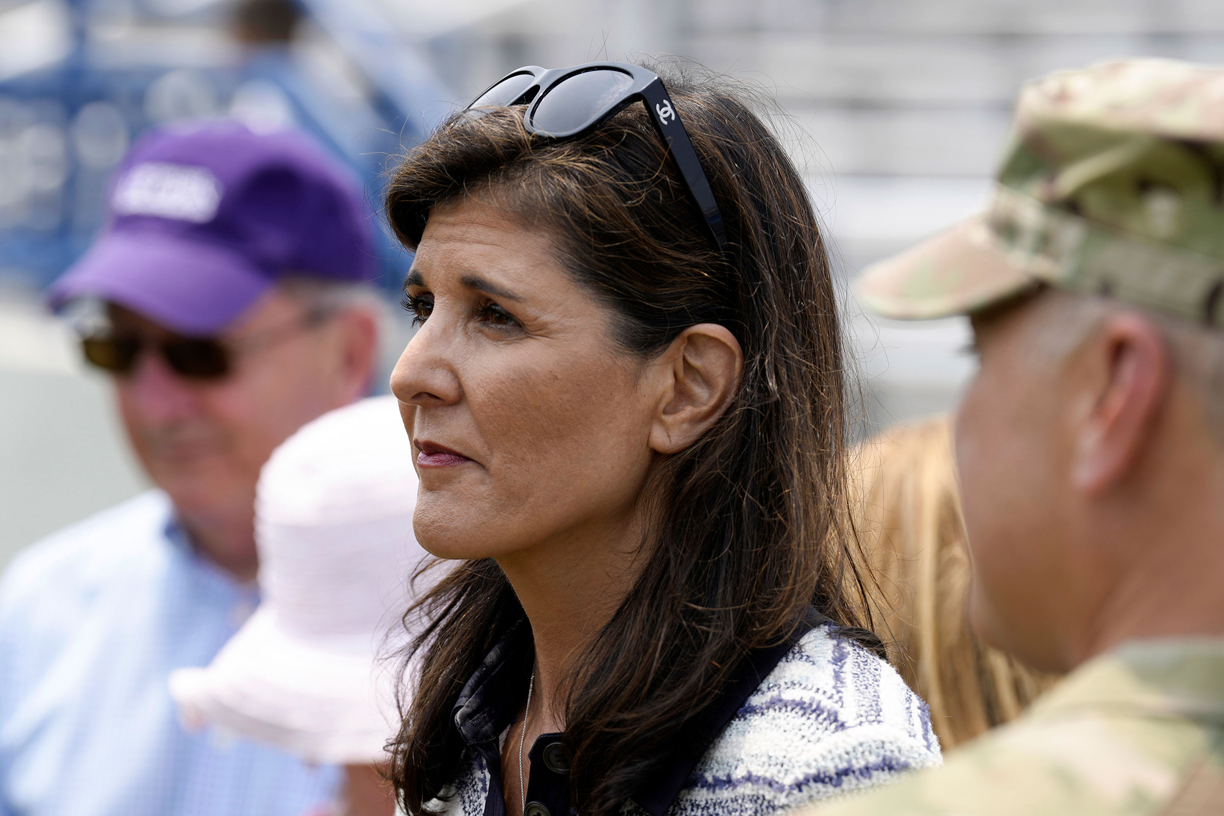 Republican presidential candidate Nikki Haley talks with other military families following a deployment ceremony for the South Carolina National Guard on Saturday, June 17, in Charleston, South Carolina.