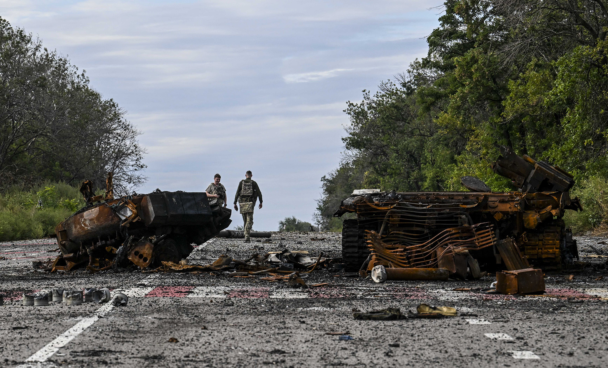 Destroyed armored vehicles litter the road in Balakliya, Ukraine's Kharkiv region, on September 10, 2022.