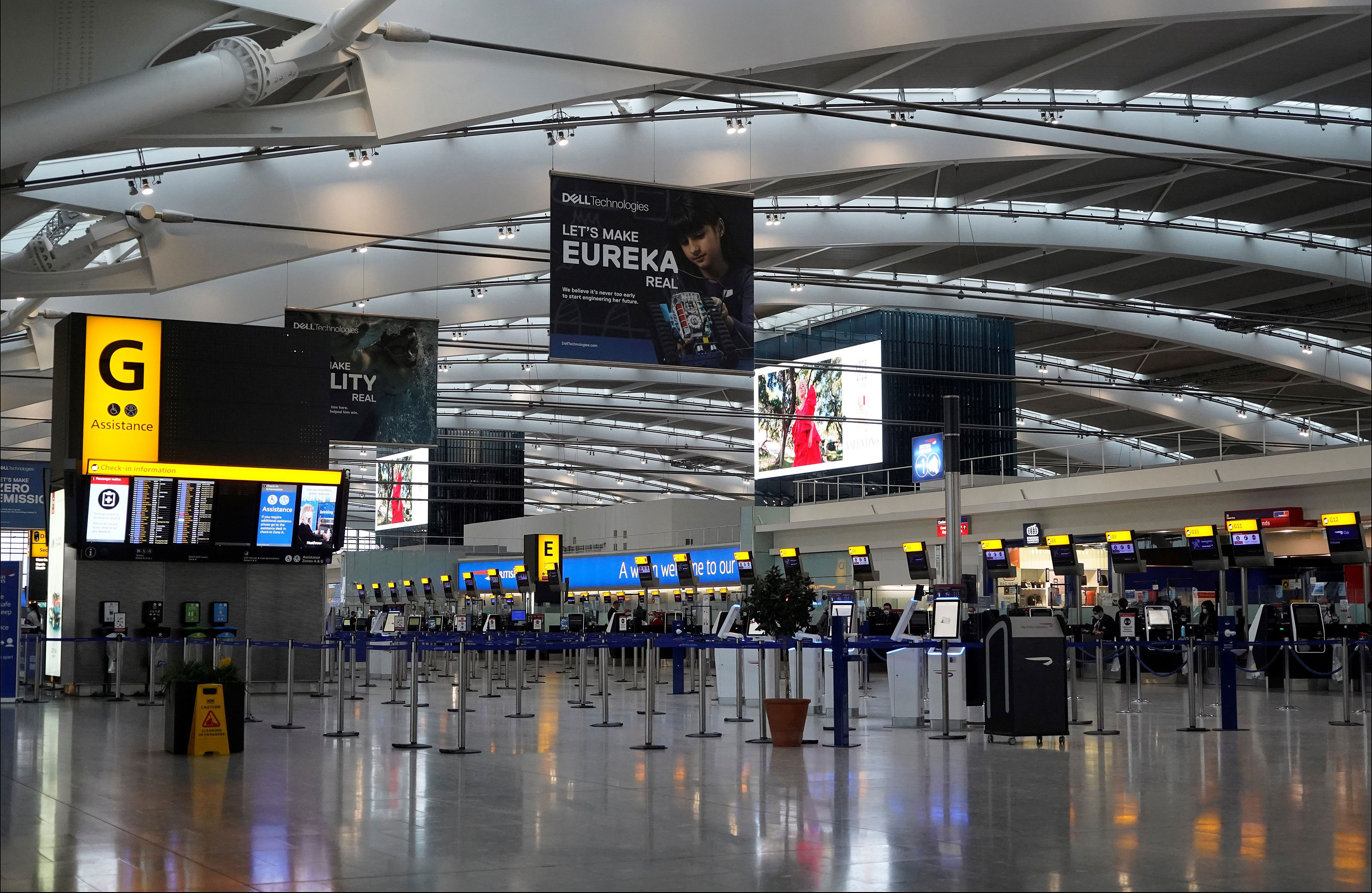 An almost deserted Terminal 5 departures hall is pictured at Heathrow Airport in London on December 21.