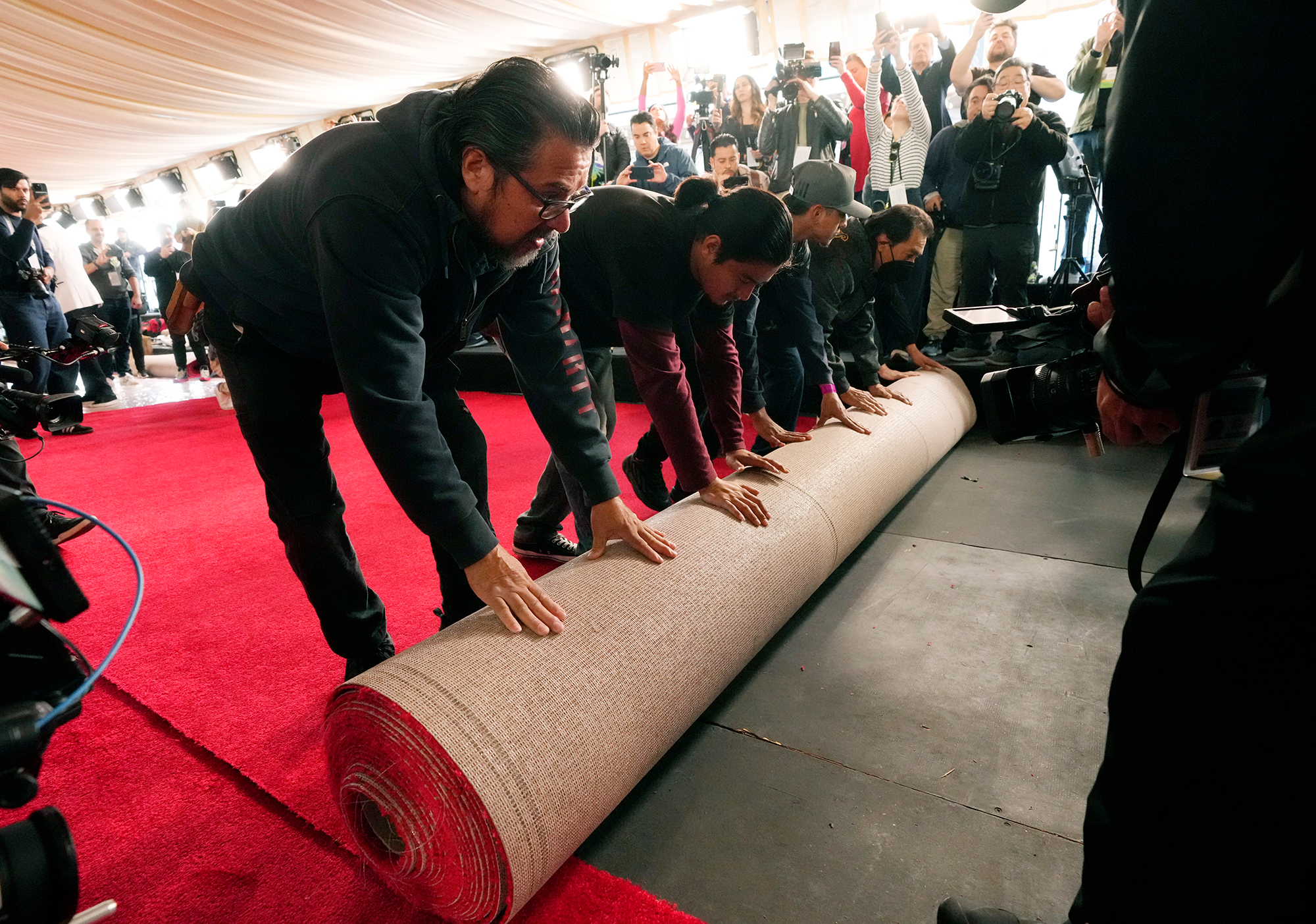Crew members roll out the red carpet for the Academy Awards on Wednesday, March 6, in Los Angeles. 