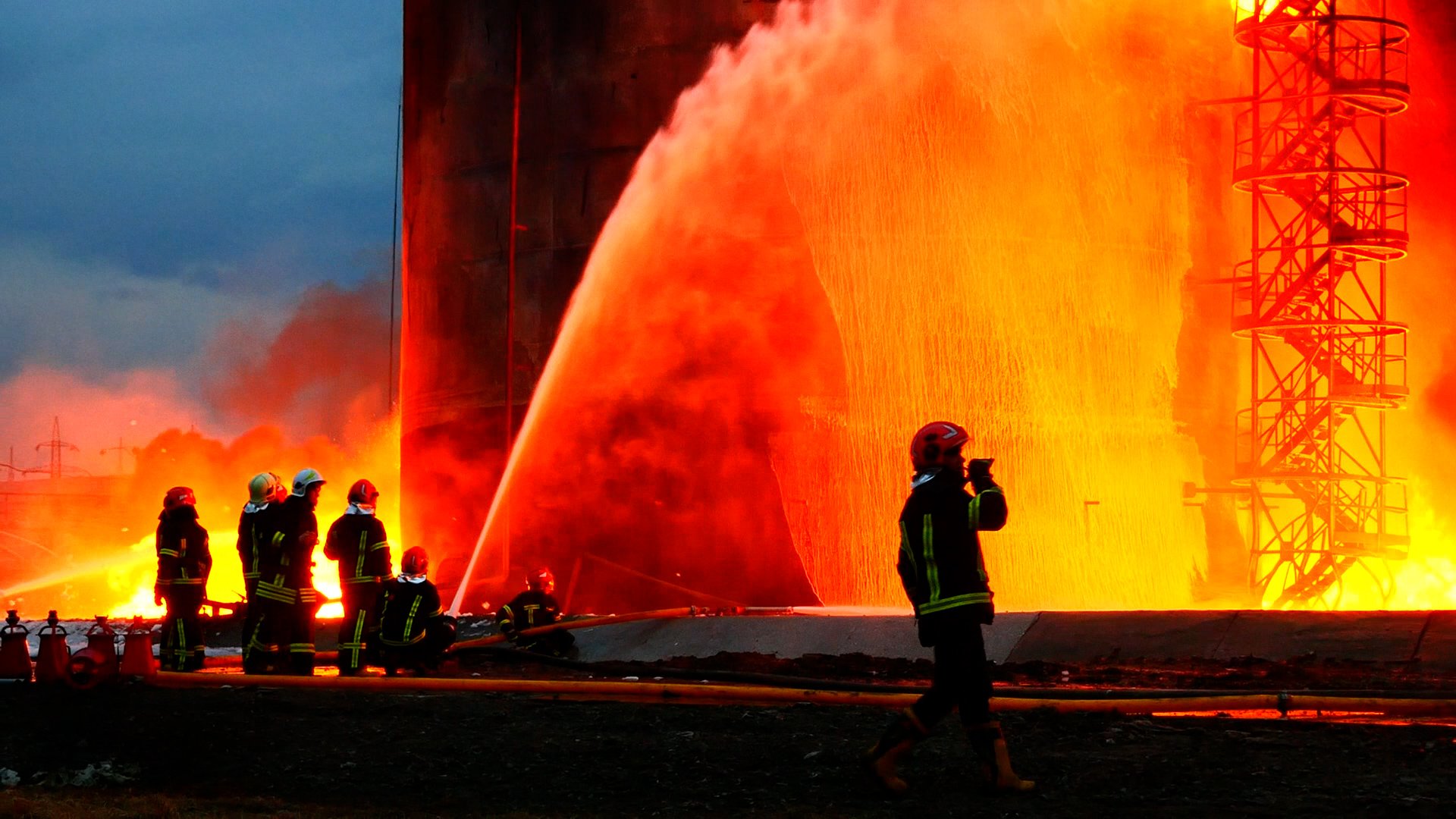 Firefighters try to extinguish the fire after Russian guided missiles hit a fuel storage facility in Lviv, Ukraine, on March 27.