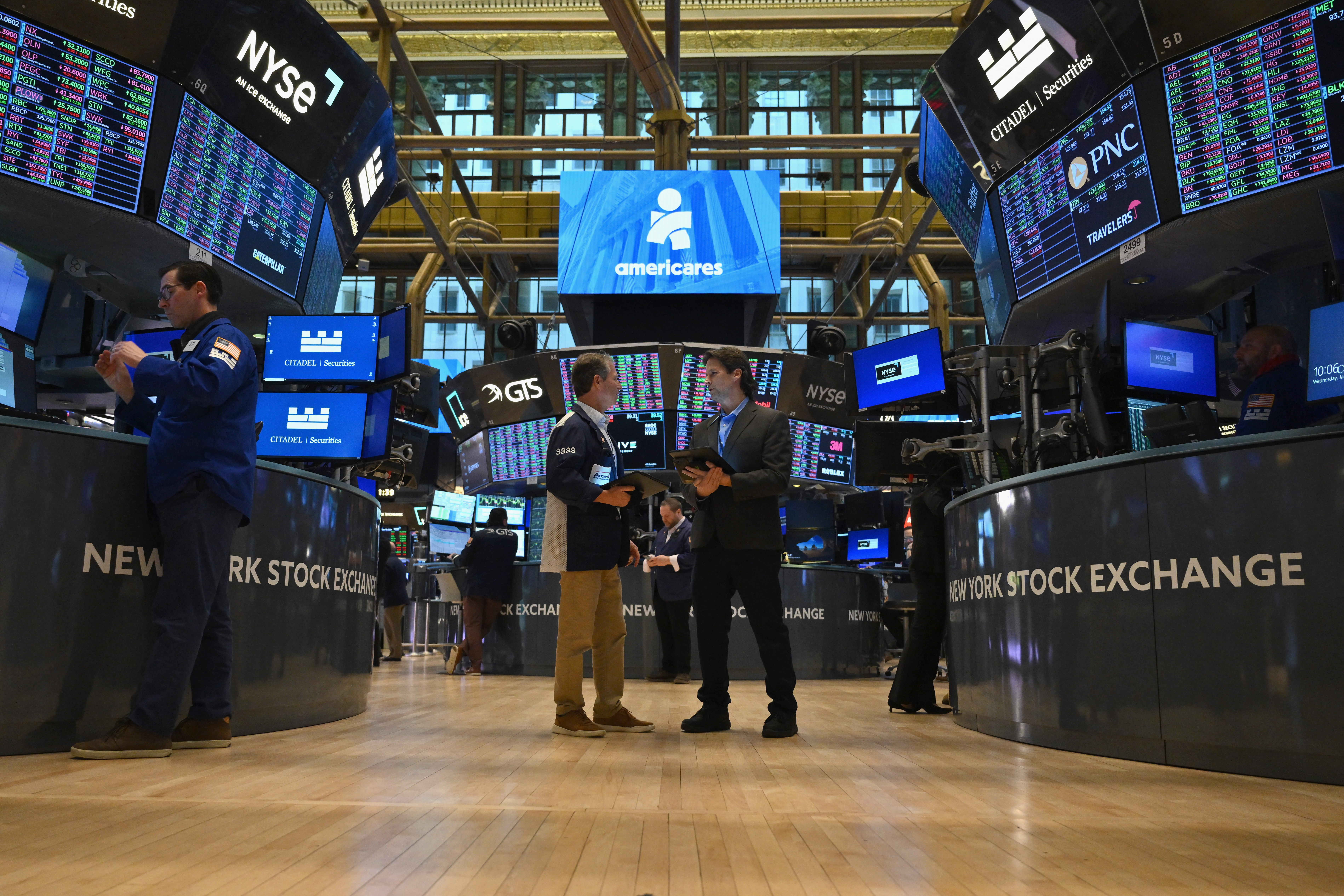 Traders work at the New York Stock Exchange on January 31.