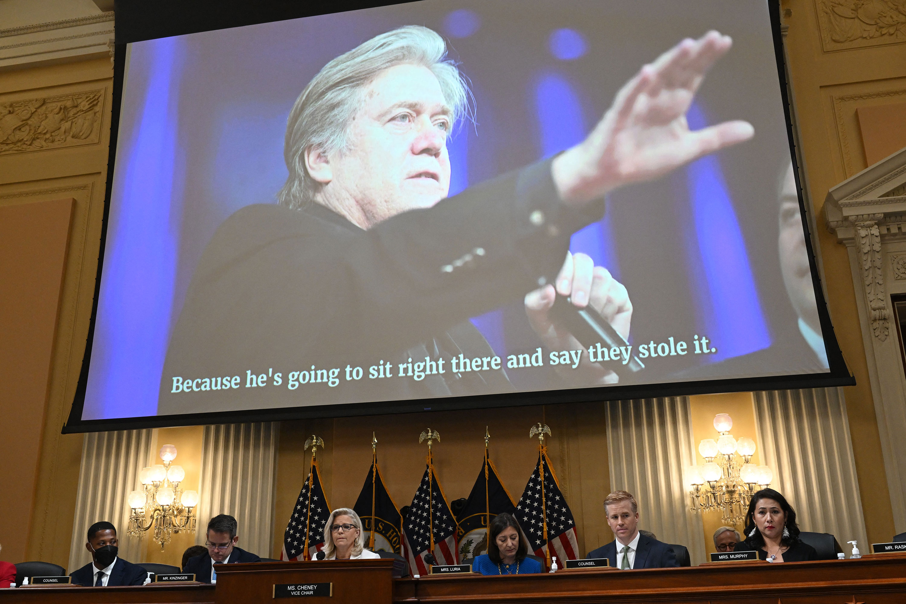 An image of Steve Bannon is displayed on screen as an audio recording is played during a hearing by the House Select Committee to investigate the January 6th attack on the US Capitol on July 21.
