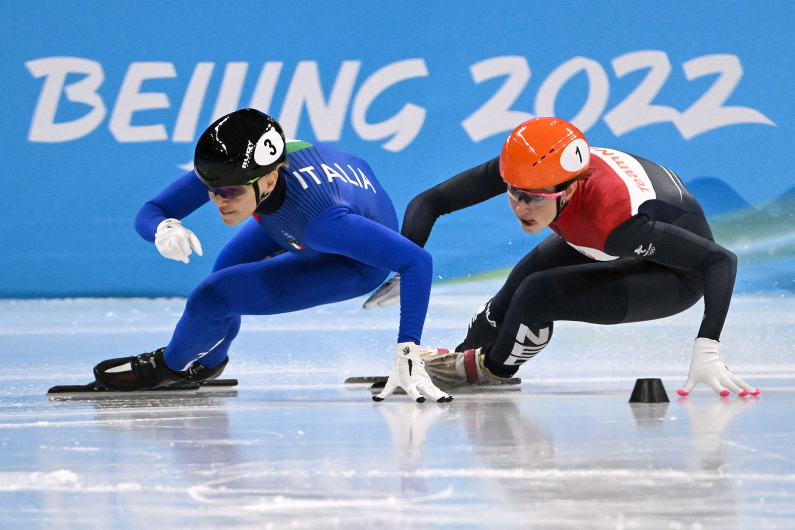 From left, Italy's Arianna Fontana and Suzanne Schulting of the Netherlands compete in the women's 500m short track speed skating event on February 7.