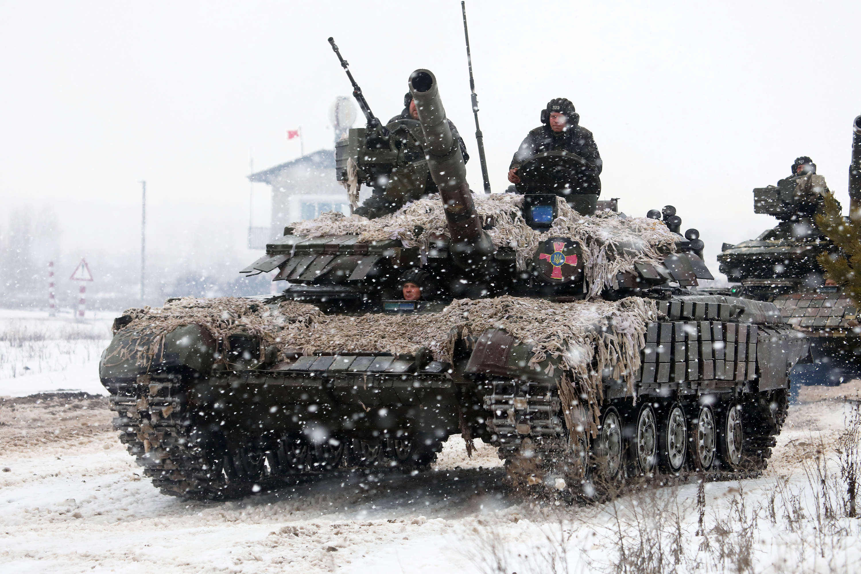 Ukrainian Armed Forces soldiers ride a tank during a drill in Kharkiv, Ukraine, on February 10. 