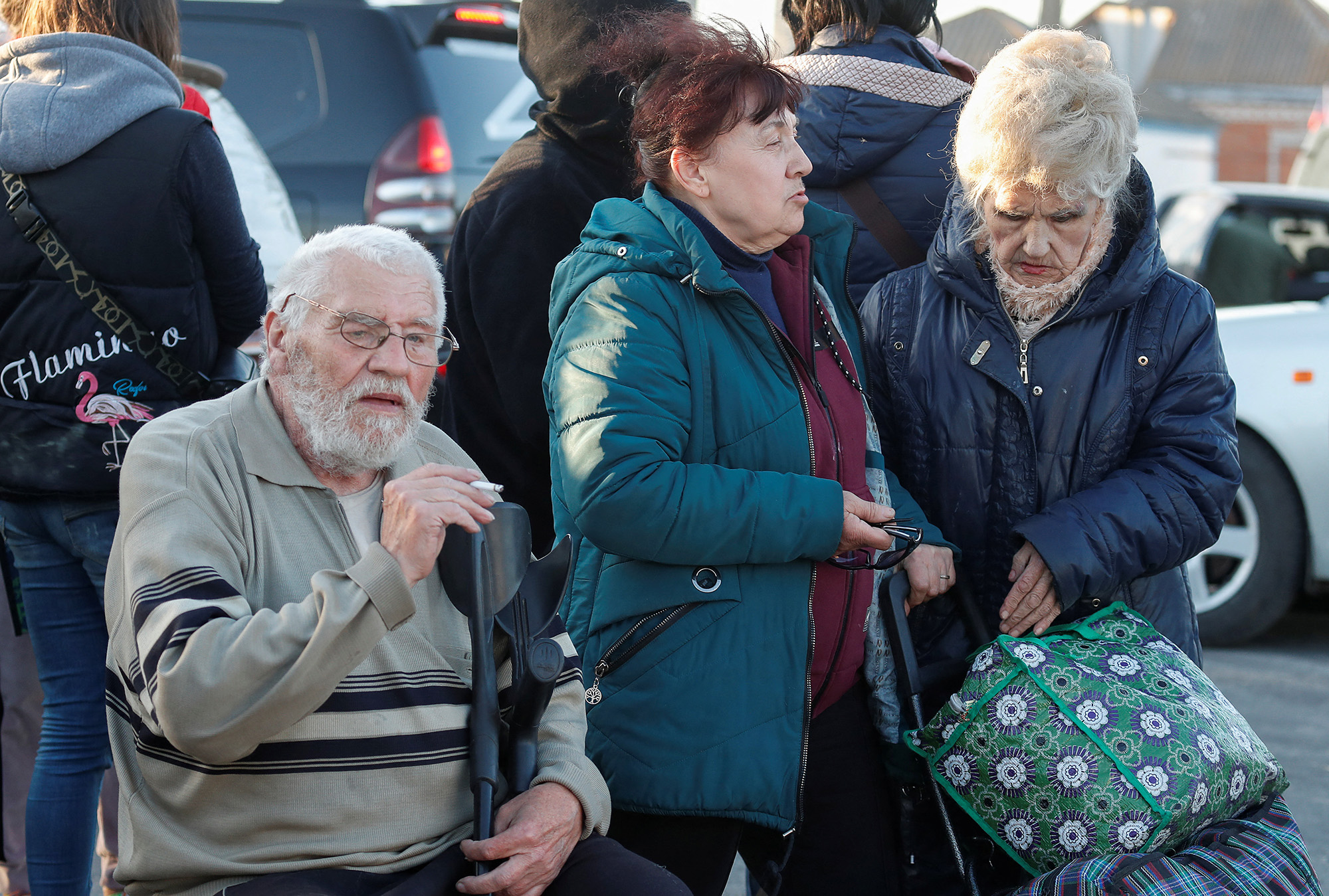Elderly people evacuated from Mariupol gather near buses at a temporary accommodation center in Bezimenne, Ukraine on Saturday May 7. 