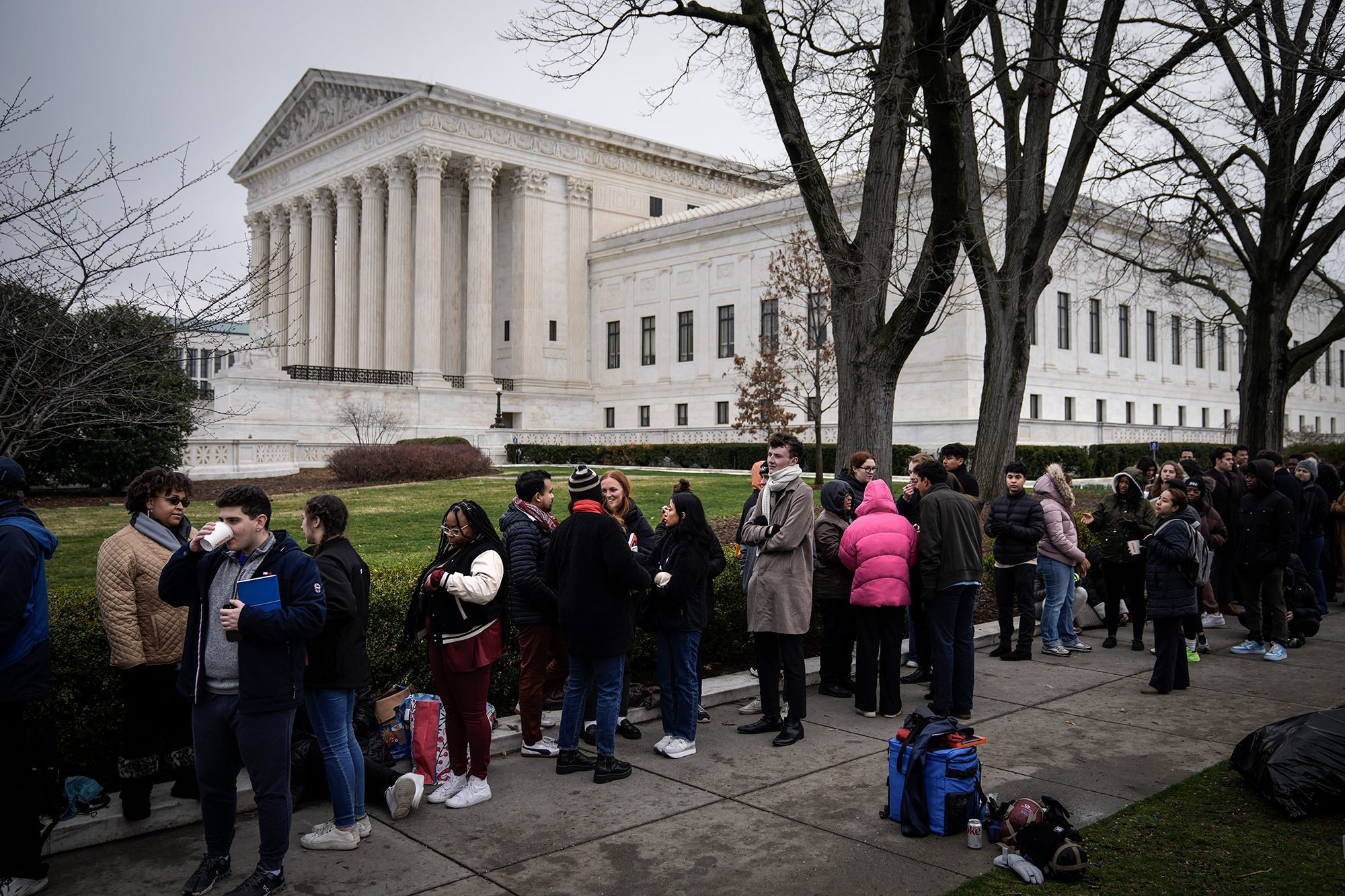 People wait in line to enter the Supreme Court to hear oral arguments on February 28 in Washington, DC.