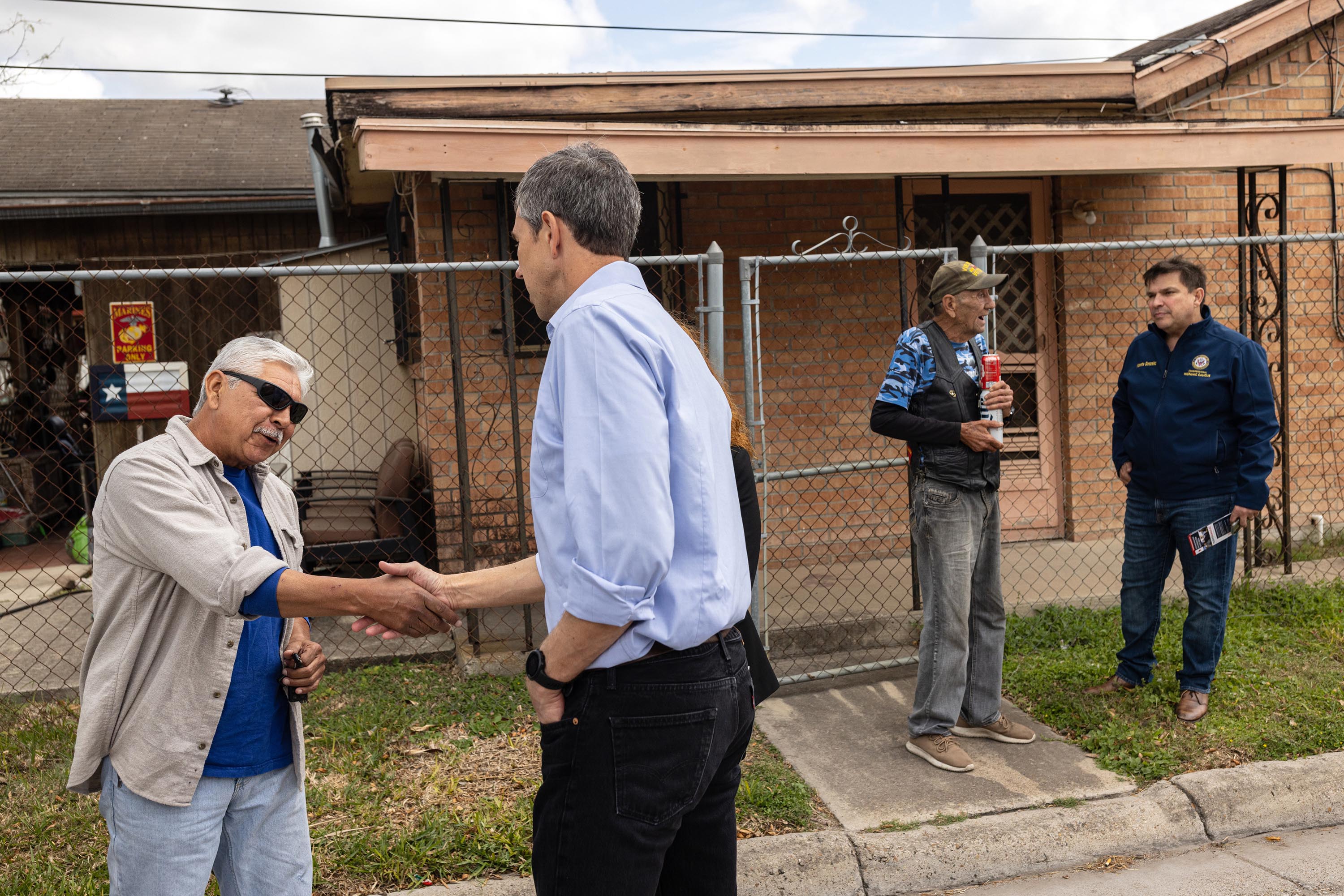 Beto O’Rourke, Texas Democratic gubernatorial candidate, and Congressman Vicente Gonzalez, who represents Texas’ 15th Congressional District and is a candidate for the redrawn 34th Congressional District, speak with (left to right) Robert Lopez and James Roussett while canvassing a neighborhood in Brownsville, Texas.