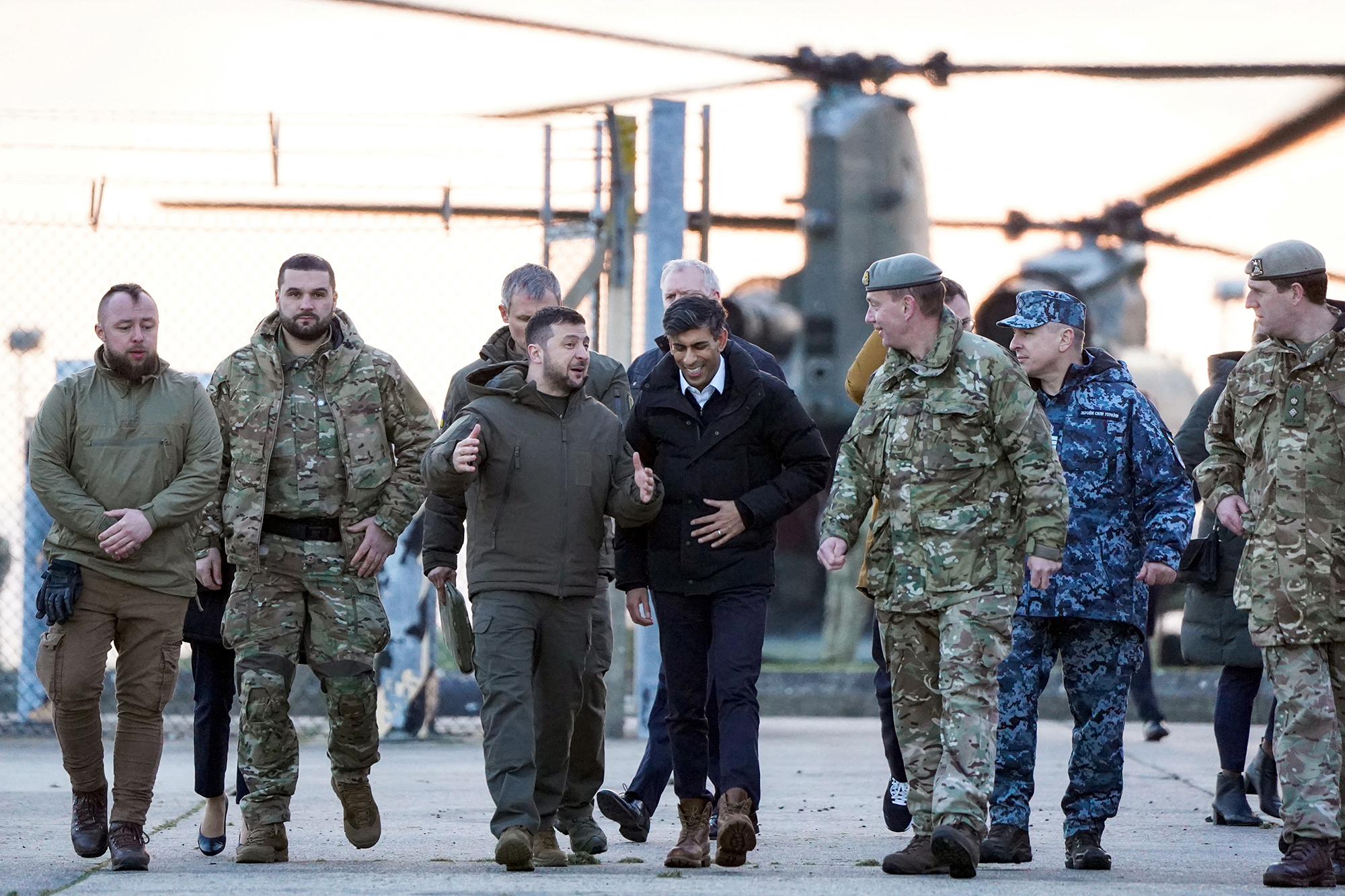 Zelensky and Sunak arrive to meet Ukrainian troops being trained to command Challenger 2 tanks at a military facility in Lulworth, England, on February 8.