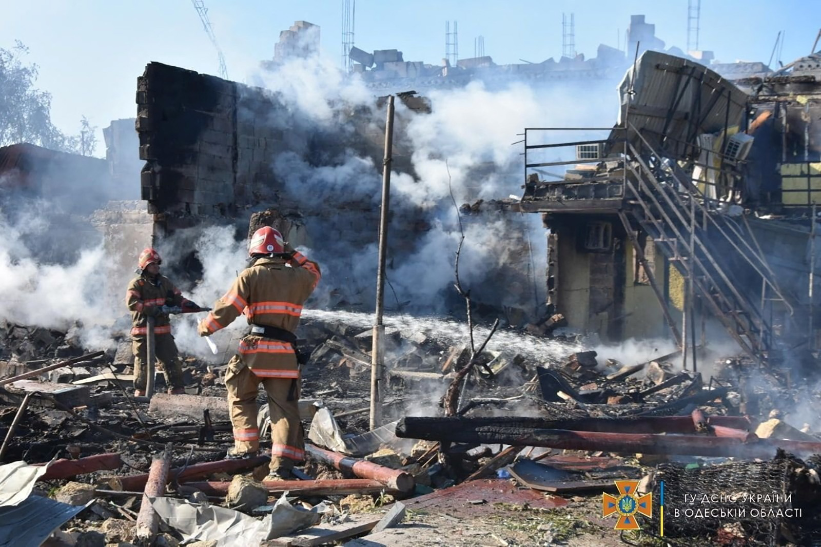 Firefighters work at site of a residential area damaged by a Russia missile strike in the settlement of Zatoka, Odesa region, Ukraine, on July 26.