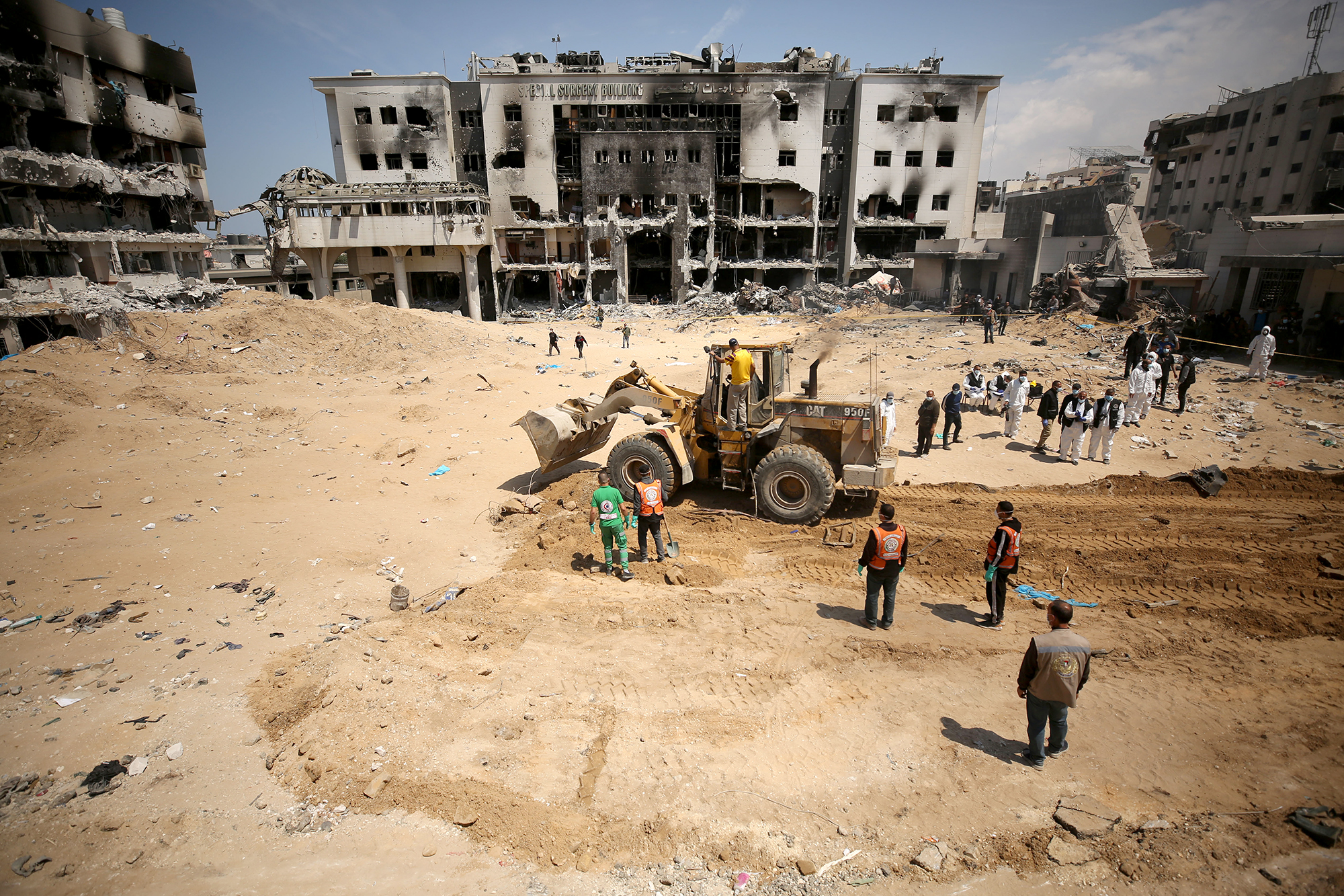 Palestinian forensic and civil defence teams investigate the grounds of Al-Shifa hospital, Gaza, on April 8.