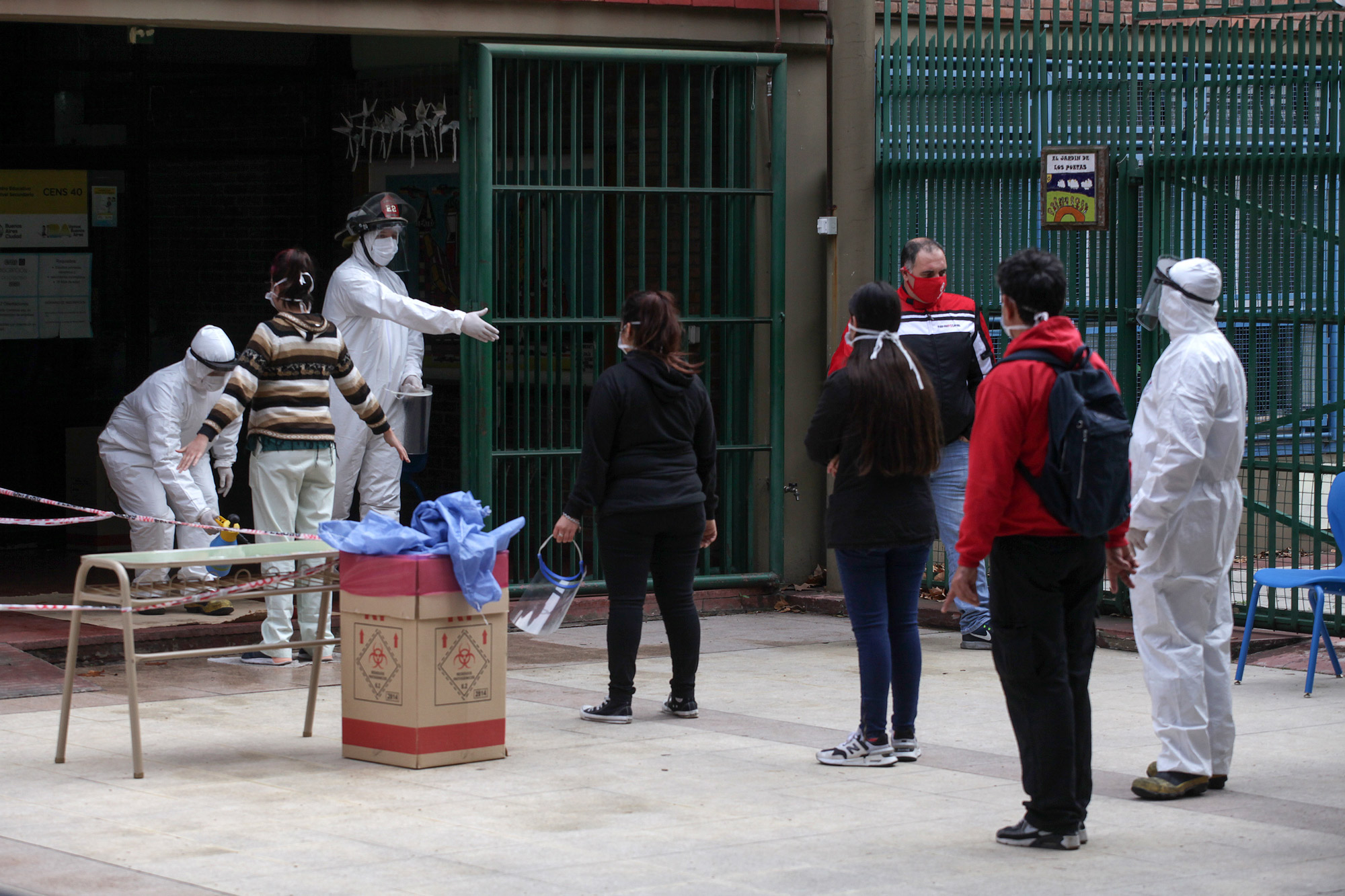 Members of Plan DETECT operation test people in the Palermo neighborhood for symptoms compatible with COVID-19 in Buenos Aires on June 24.