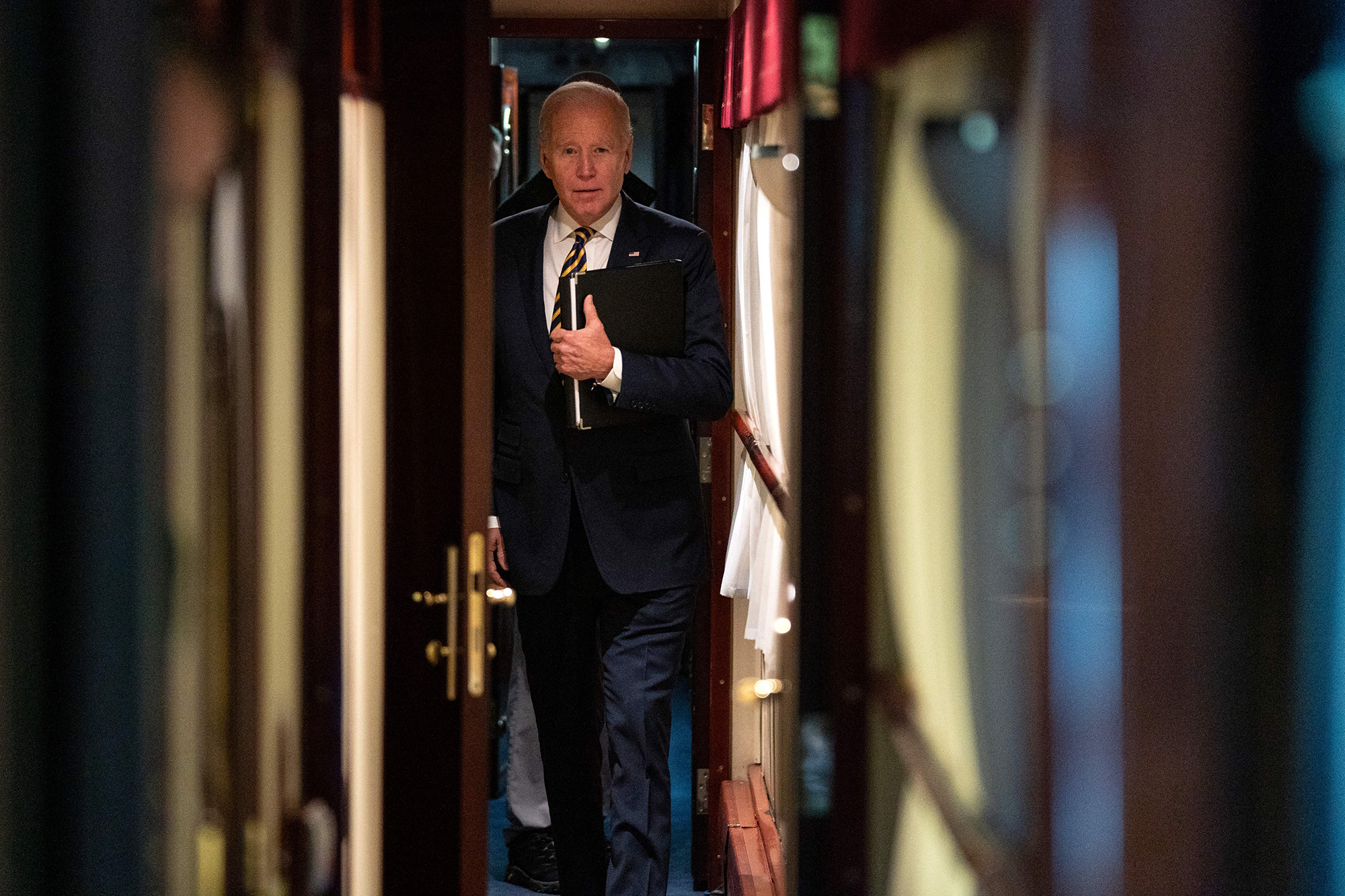 US President Joe Biden walks down a train corridor to his cabin after a surprise visit with Ukrainian President Volodymyr Zelensky in Kyiv on February 20.
