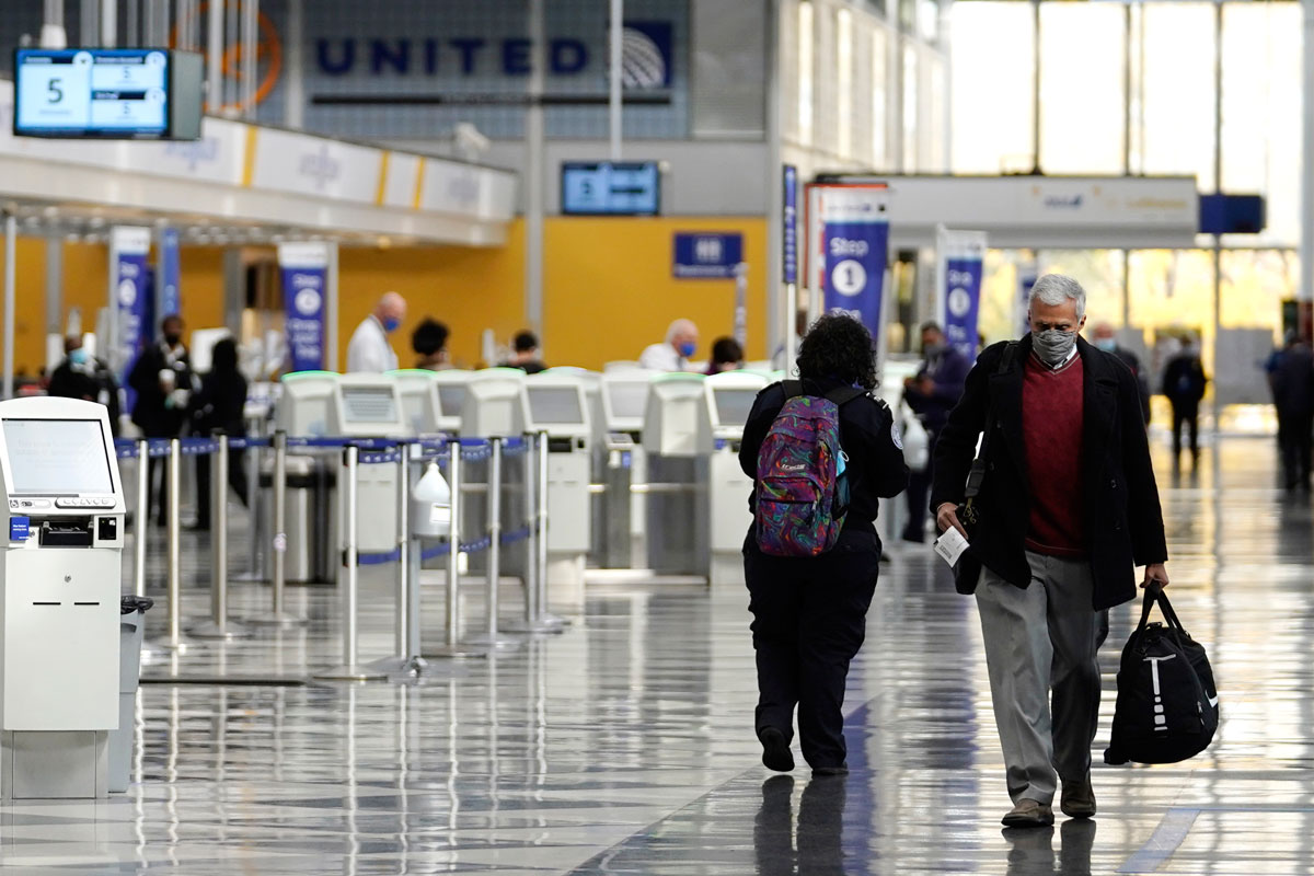 Travelers walk through Terminal 1 at O'Hare International Airport in Chicago, on October 14.
