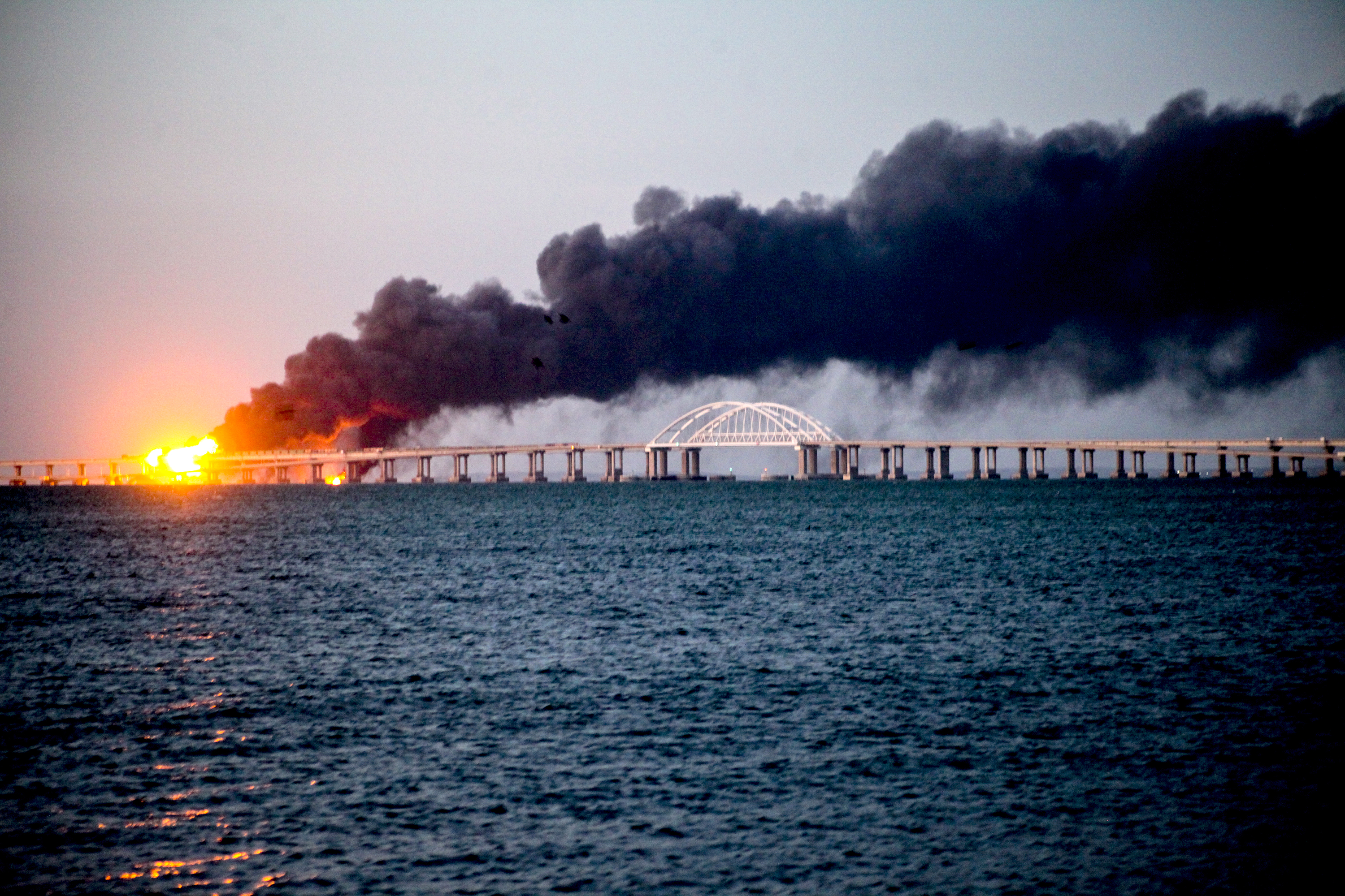 Smoke rises above the Kerch Bridge after an explosion on October 8, 2022 in Crimea. 
