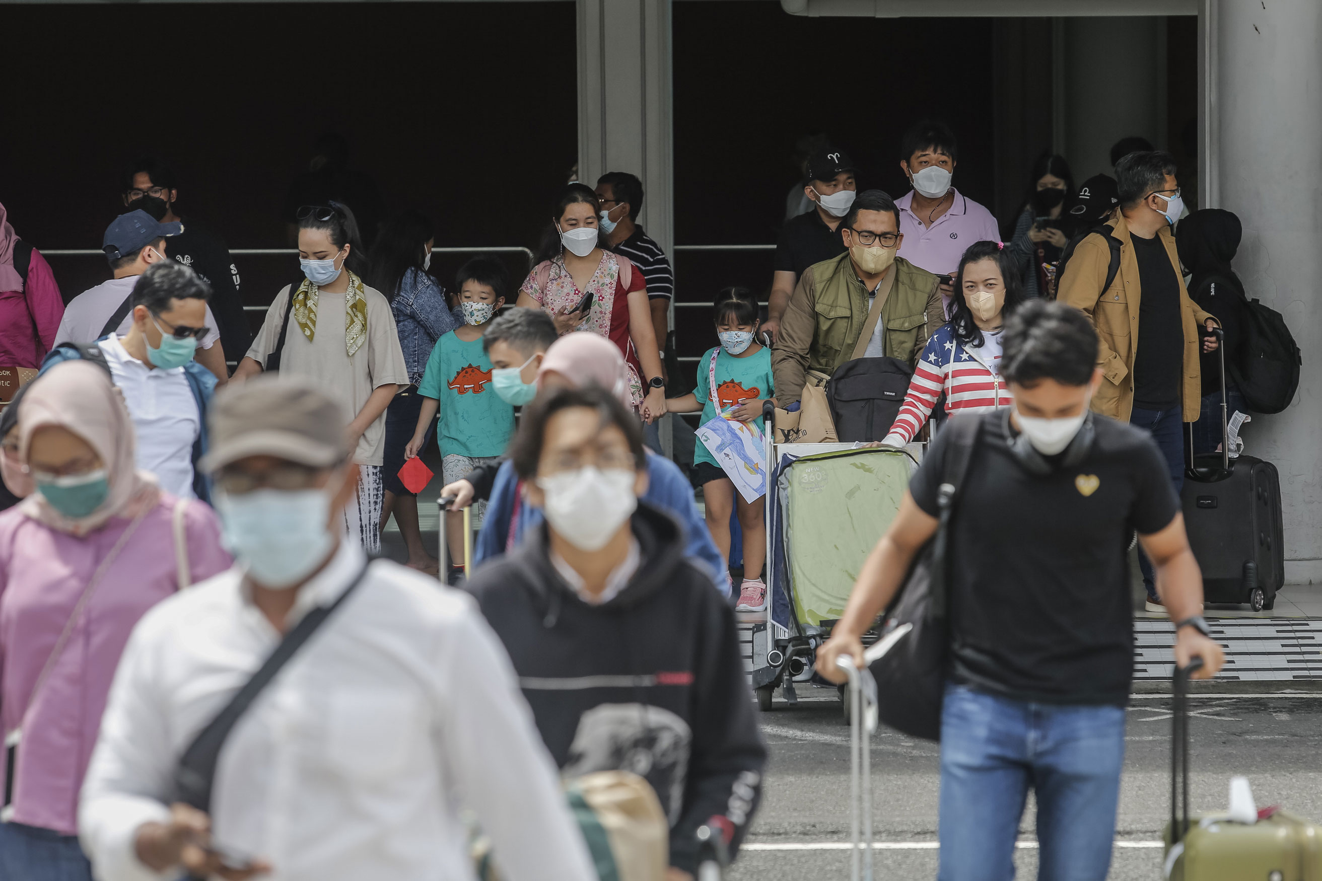 Domestic tourists arrive ahead of the end of year holidays season amid at the Gusti Ngurah Rai Airport in Kuta, Bali, Indonesia on December 22,