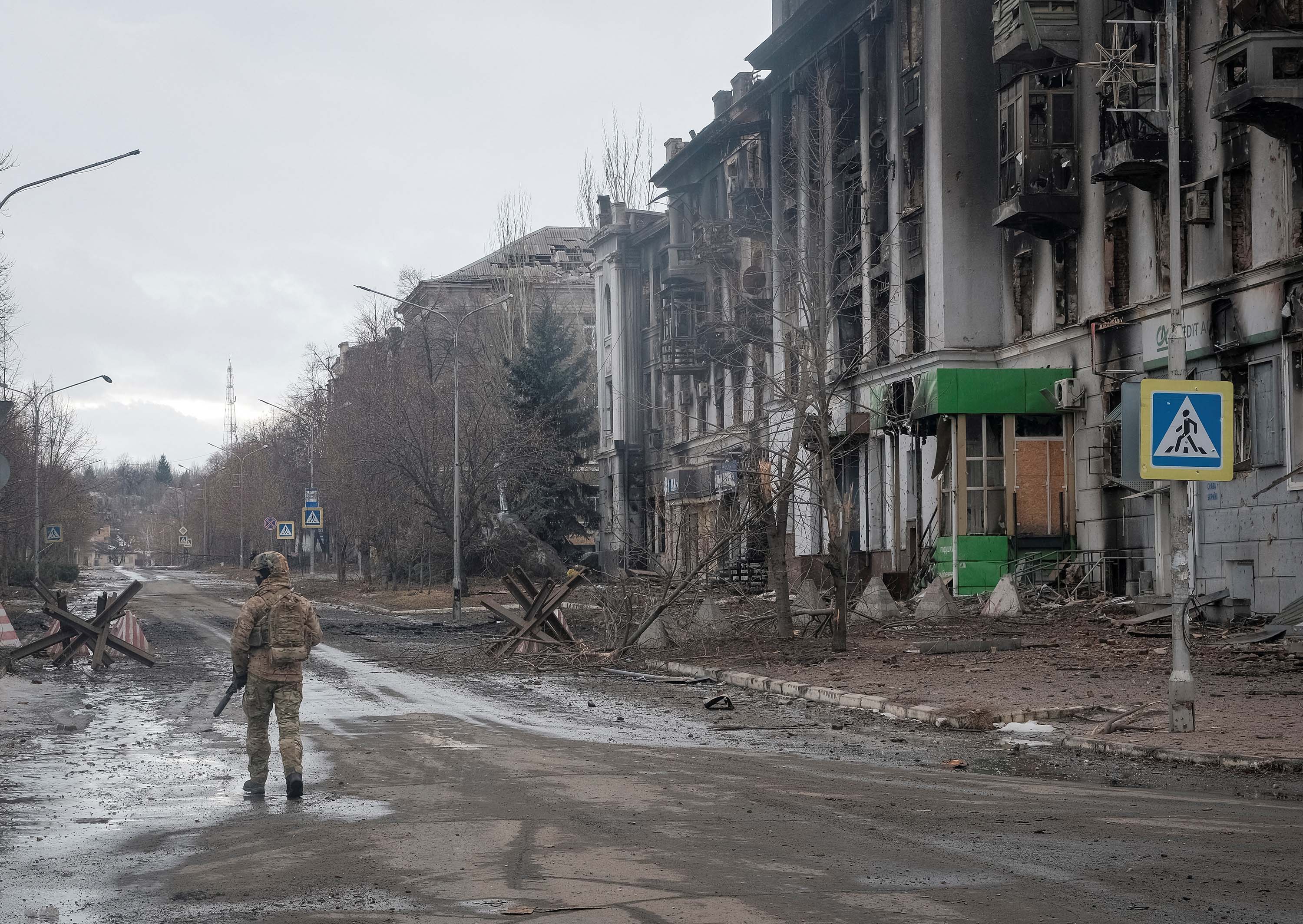 A Ukrainian serviceman patrols an empty street in Bakhmut, Ukraine, on February 21. 