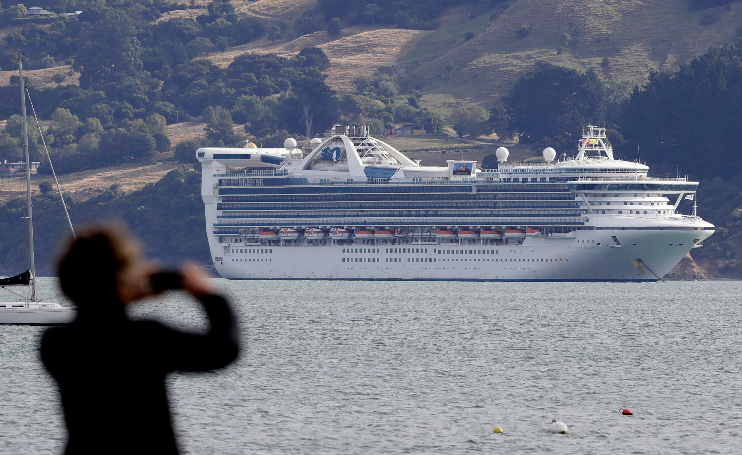 The Golden Princess sits anchored off the coast of New Zealand on Sunday, March 15.