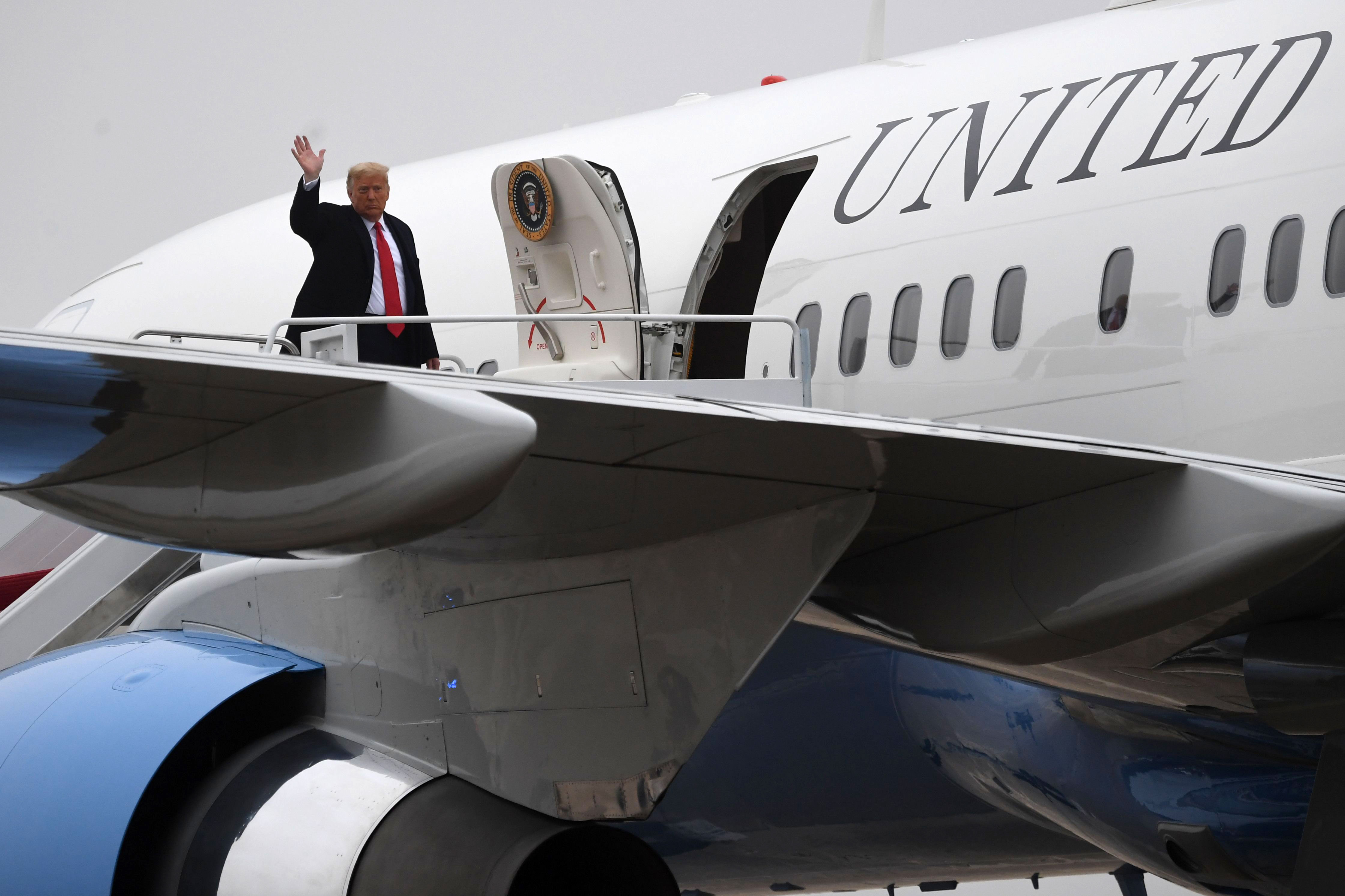 President Donald Trump boards Air Force One on October 26, prior to departure from Joint Base Andrews in Maryland.
