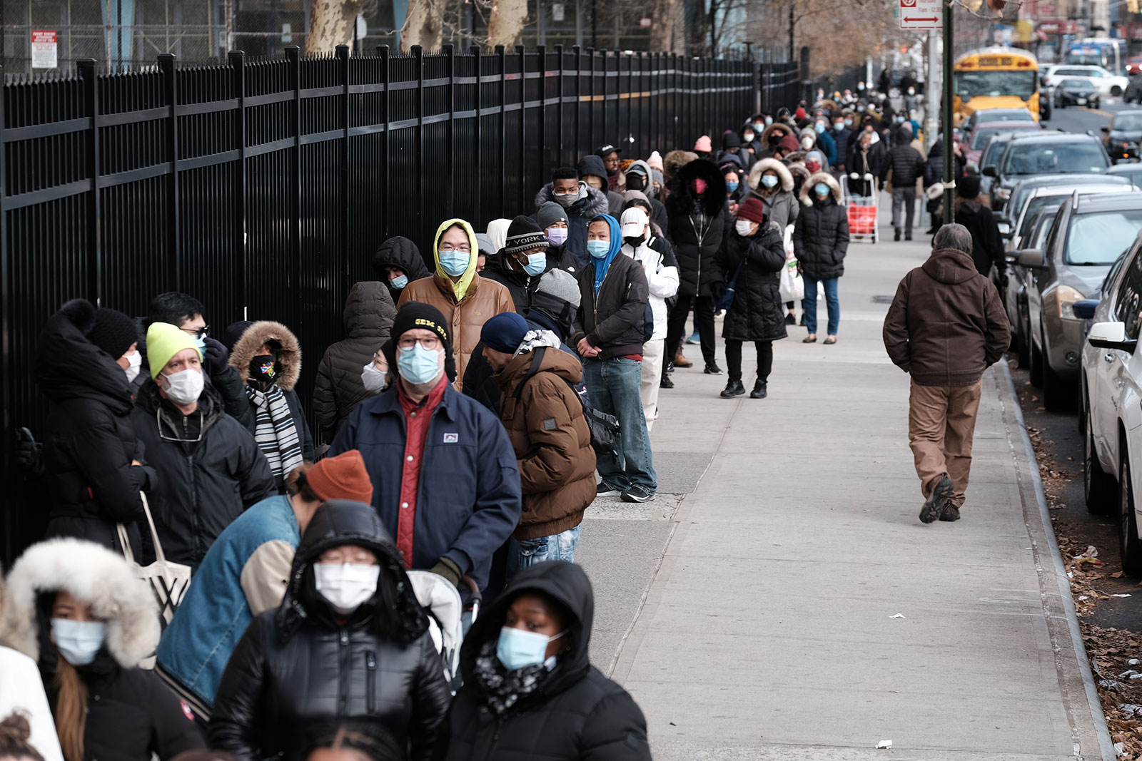 People wait in line for take-home Covid-19 test kits in New York on December 23.