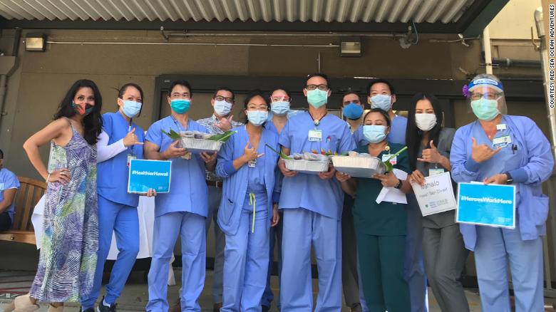 Health care workers at the Straub Medical Center with the donated tuna poke bowls.