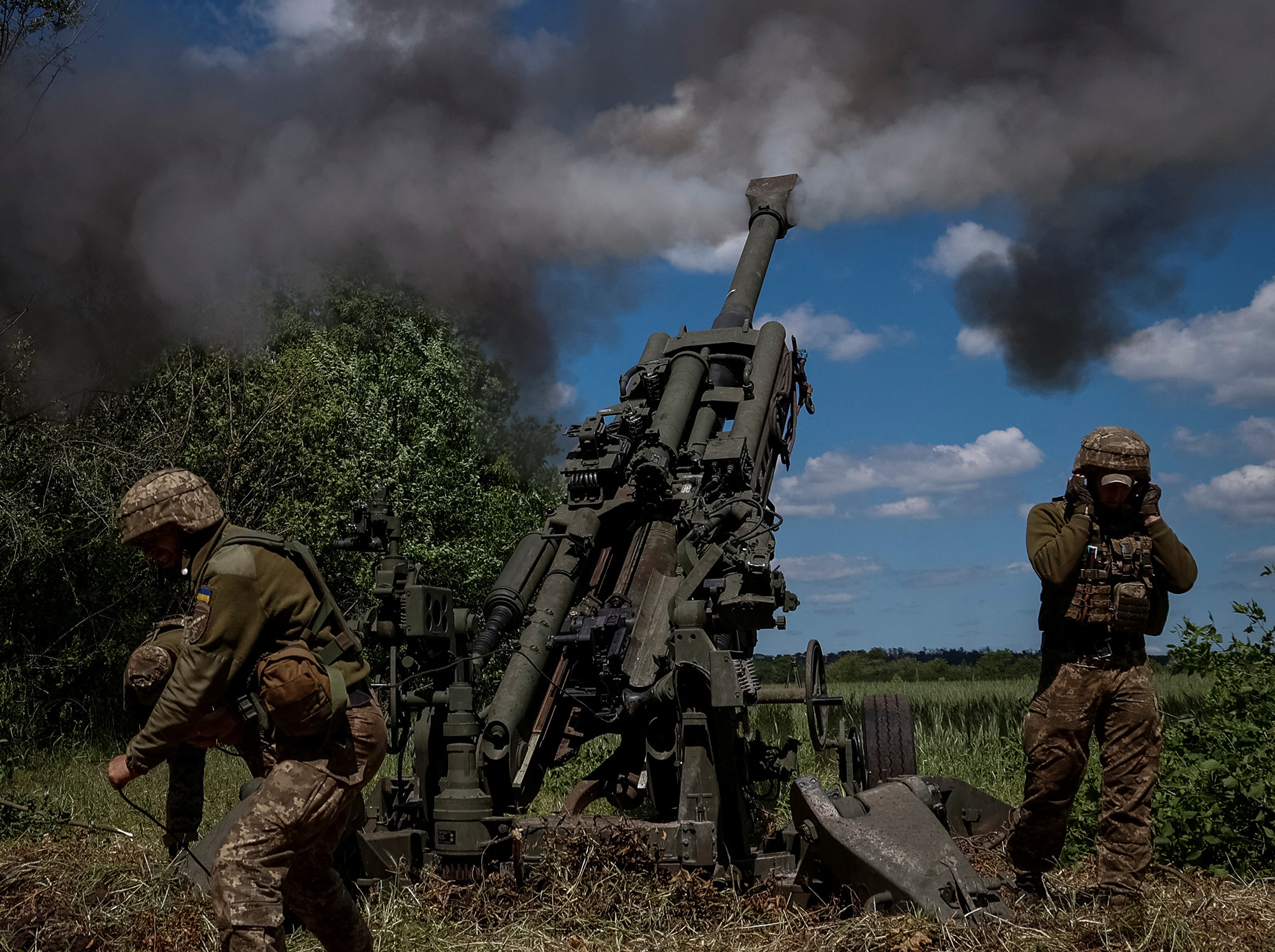 Ukrainian military fire a shell from a M777 Howitzer near the front line in the Donetsk region, Ukraine, on June 6.