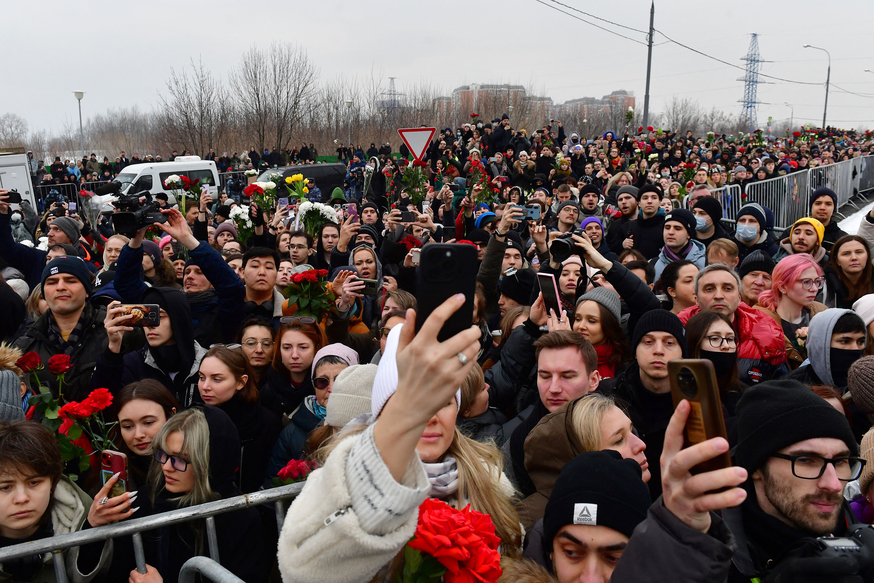Mourners stand outside Borisovsky cemetery in Moscow as Alexey Navalny is laid to rest on Friday.