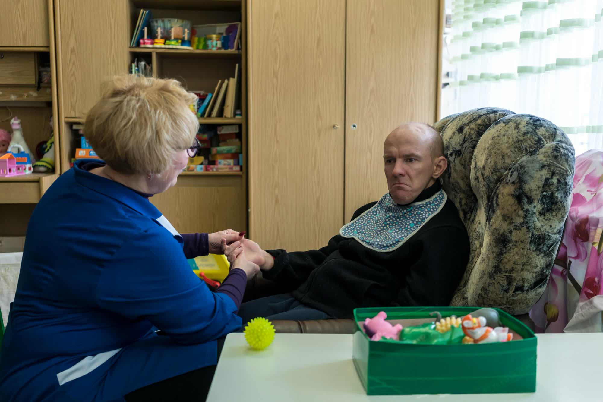 Psychologist Olha Titorovska works with client Yaroslav Repich at BlahoDar, a Slavutych rehabilitation center for people with disabilities.