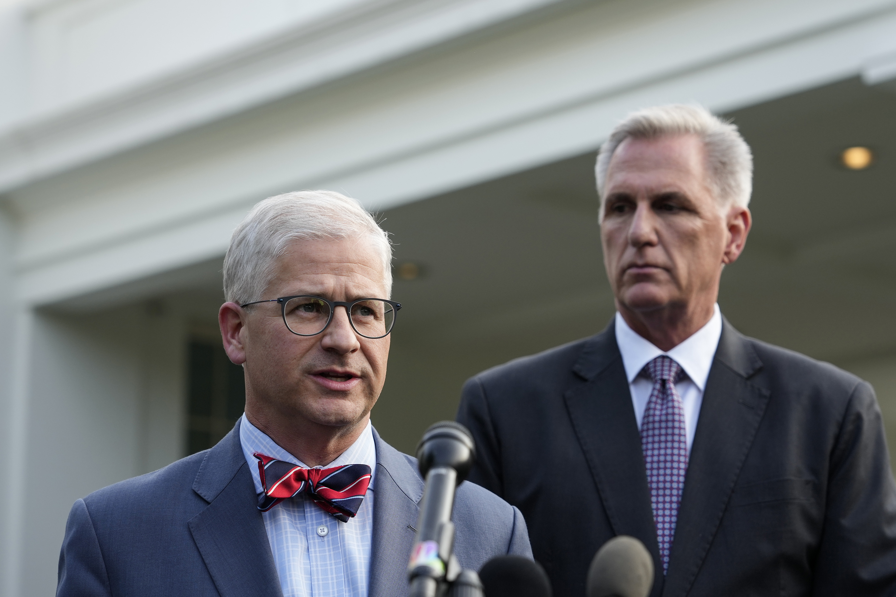 Rep. Patrick McHenry (R-NC), left, and House Speaker Kevin McCarthy (R-CA) talk to reporters outside the West Wing after meeting with President Joe Biden in the Oval Office of the White House on May 22.