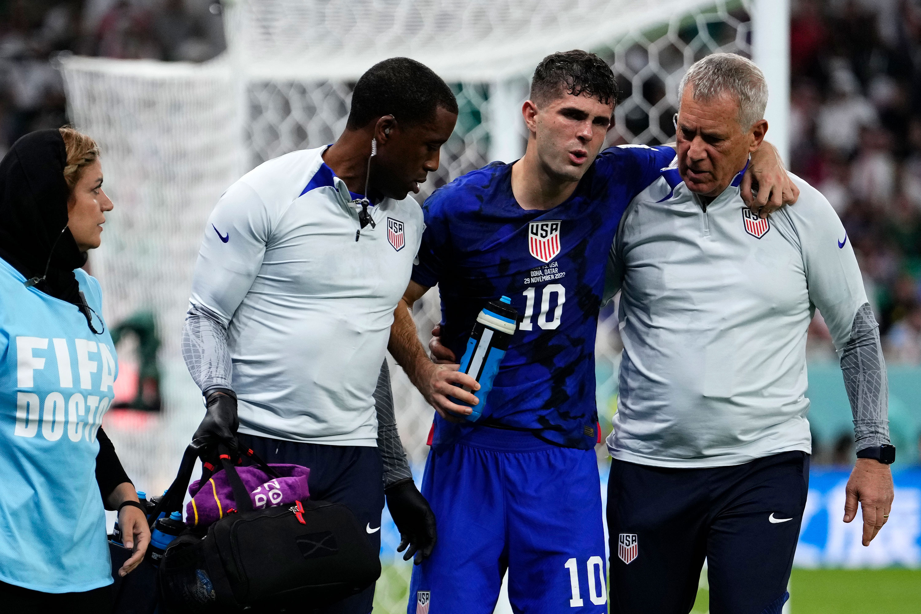 Christian Pulisic of the United States is helped off the pitch after suffering an injury during the match against Iran on Tuesday.