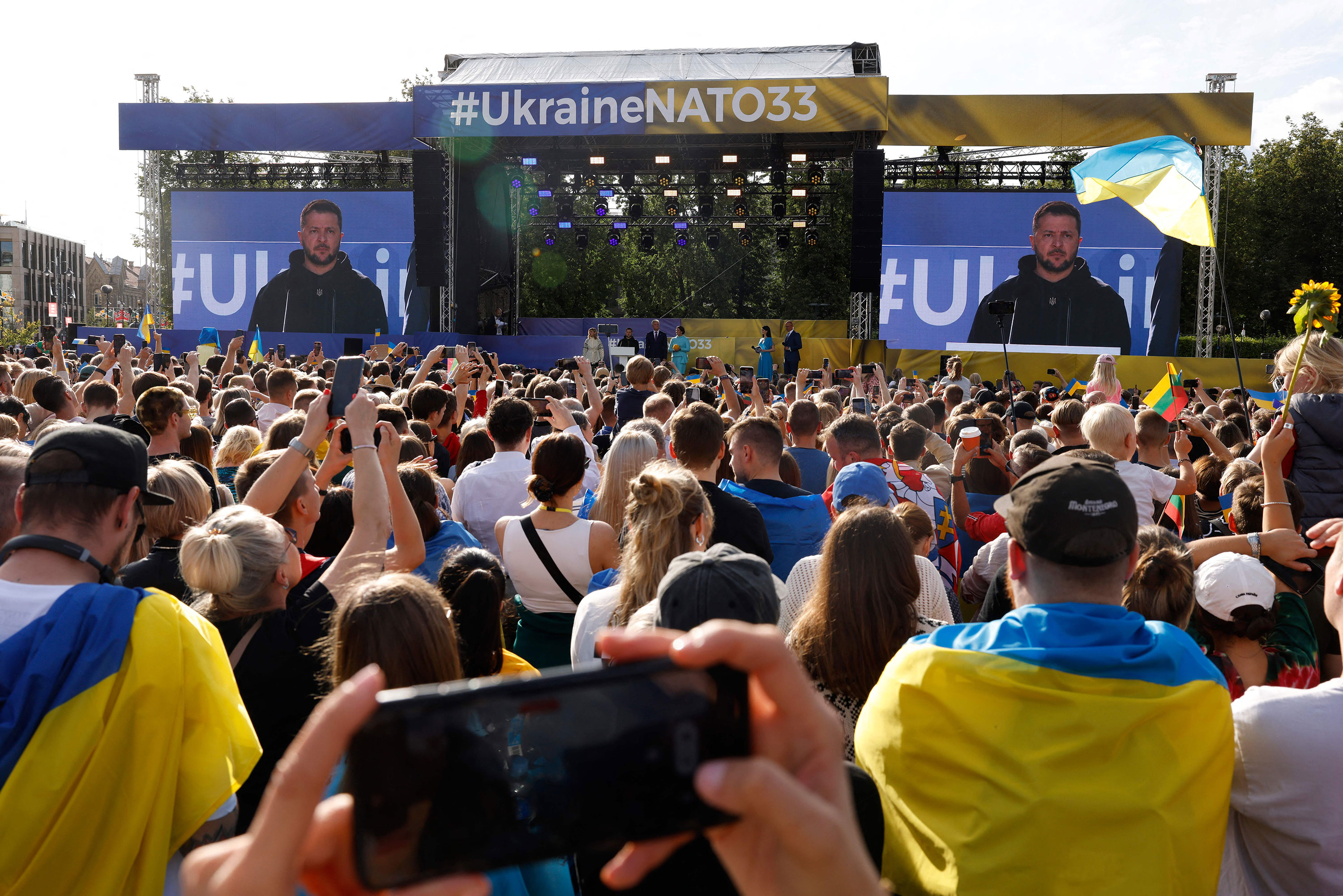 Ukrainian President Volodymyr Zelensky addresses the crowd at Lukiskiu Square in Vilnius, Lithuania, on Tuesday.