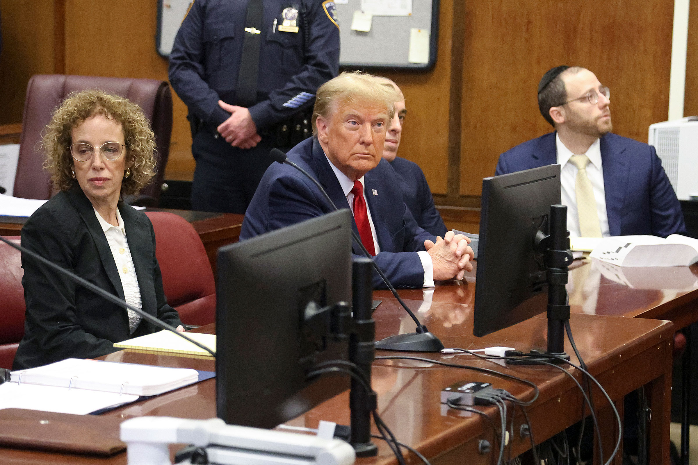 Donald Trump awaits the start of a hearing in New York City Criminal Court, Thursday, February 15, 2024. 