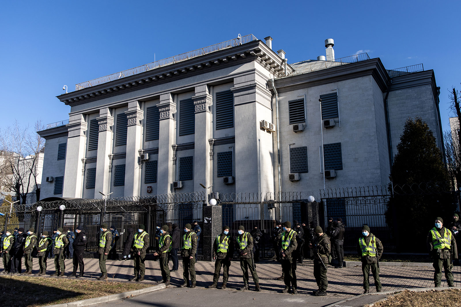 Police stand guard in front of the Russian Embassy in Kyiv on February 22.