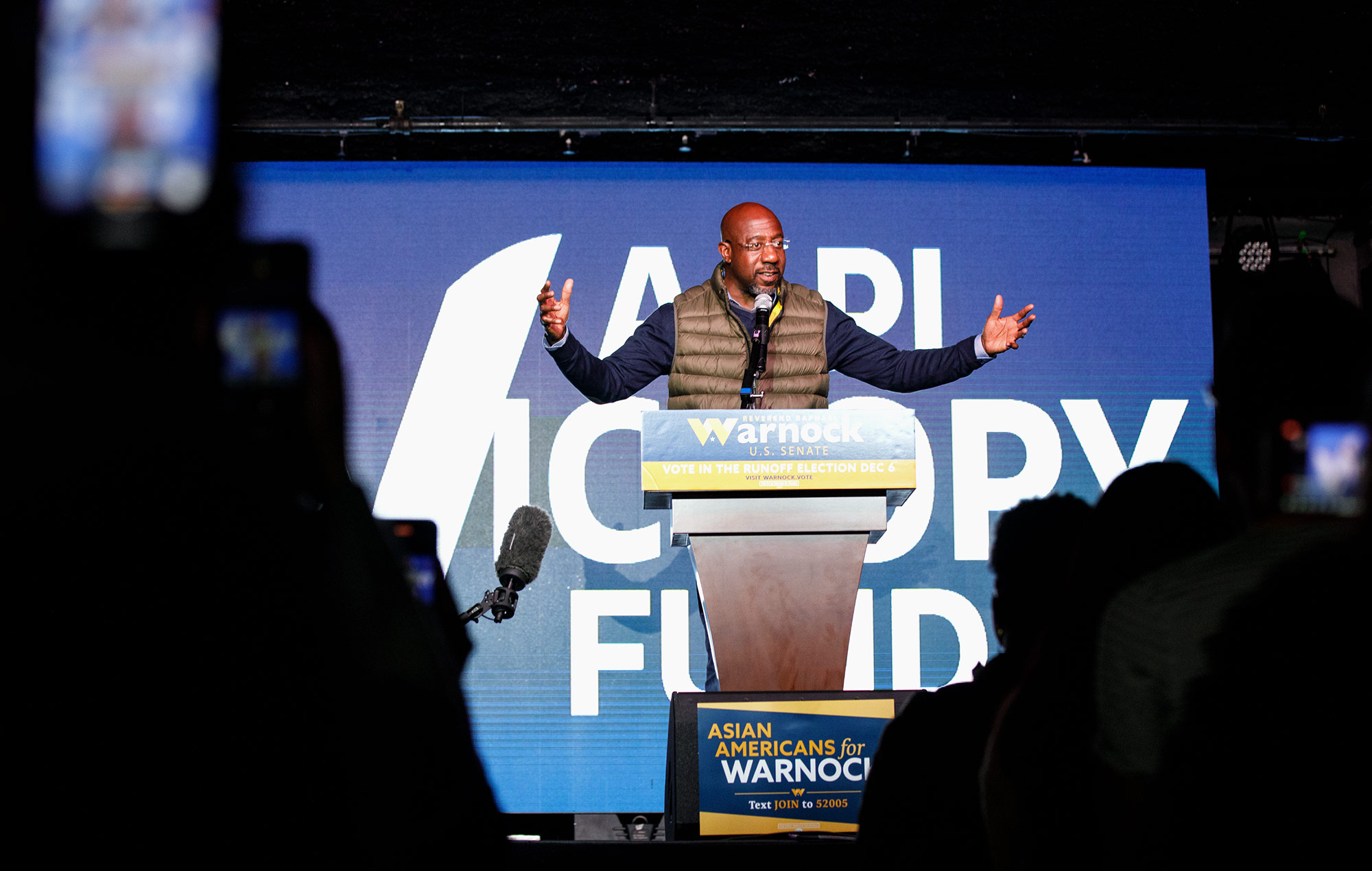 Sen. Raphael Warnock speaks during a rally hosted by the AAPI Victory Fund and Warnock for Georgia on Saturday, December 3, in Atlanta, Georgia.