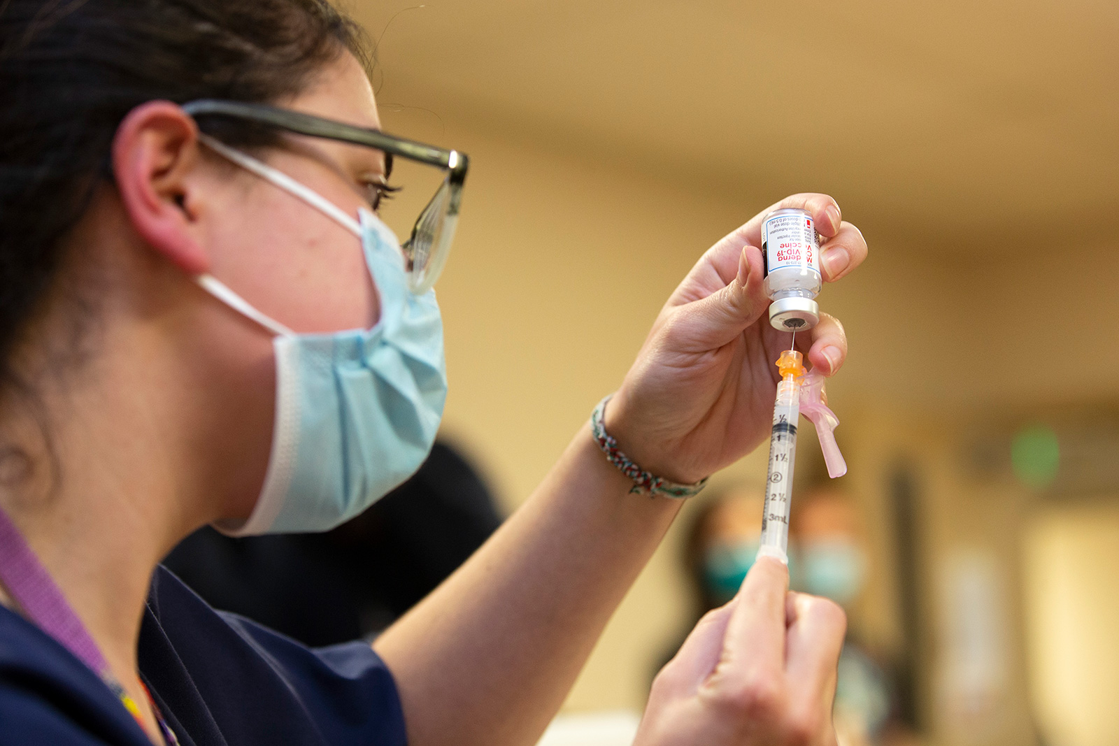 Colleen D Amico, a clinical pharmacist with Seattle Indian Health Board (SIHB) administers a shot of the Moderna Covid-19 vaccine to frontline workers at the SIHB on December 21, 2020 in Seattle, Washington. 