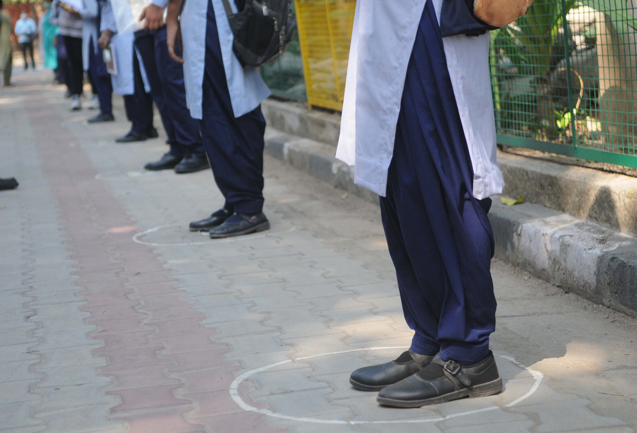 Students stand in circles for social distancing at the Government Model Senior Secondary School, on November 2, in Chandigarh, India. 
